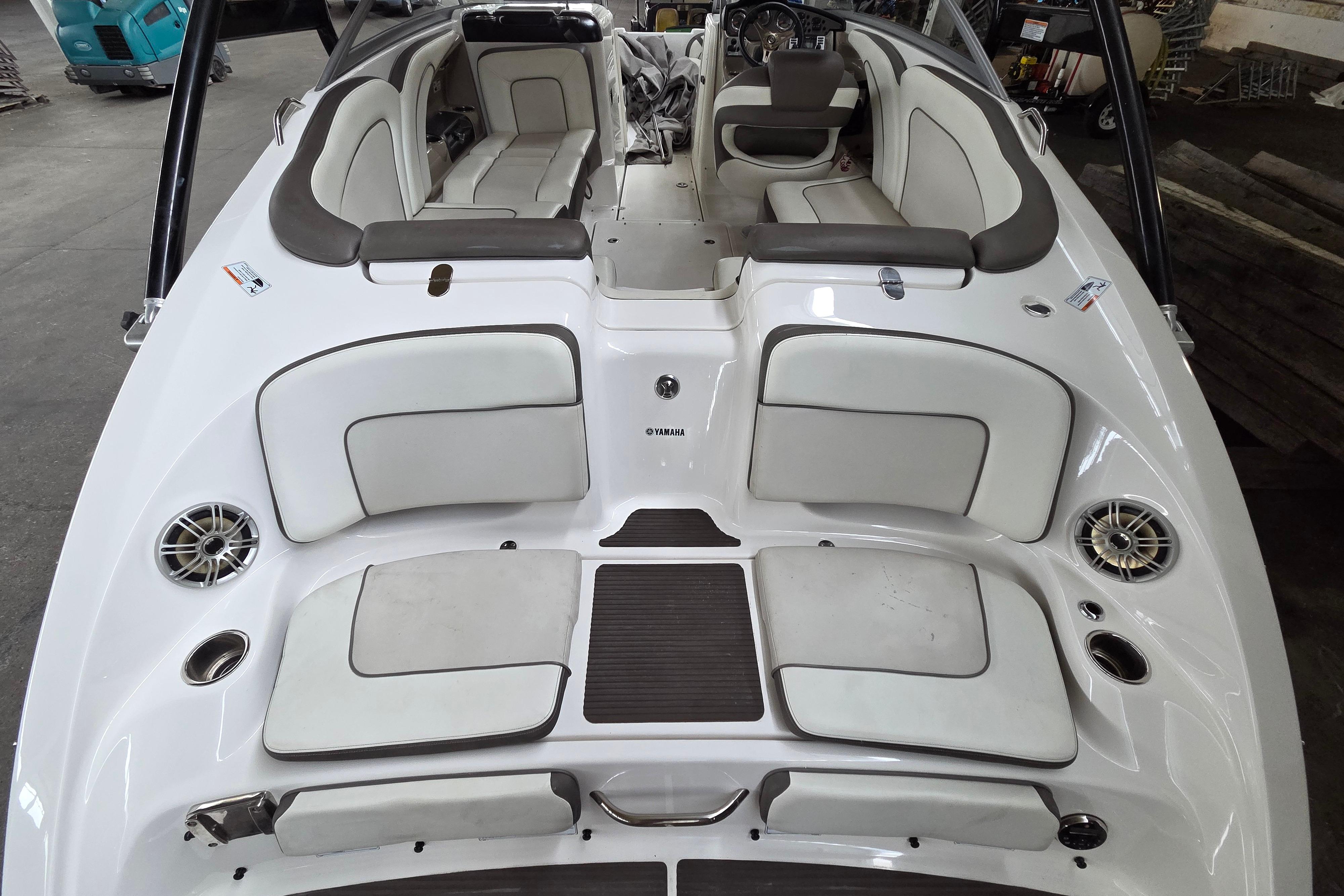 2013 Yamaha 242 Limited S boat interior with white seating and modern design.