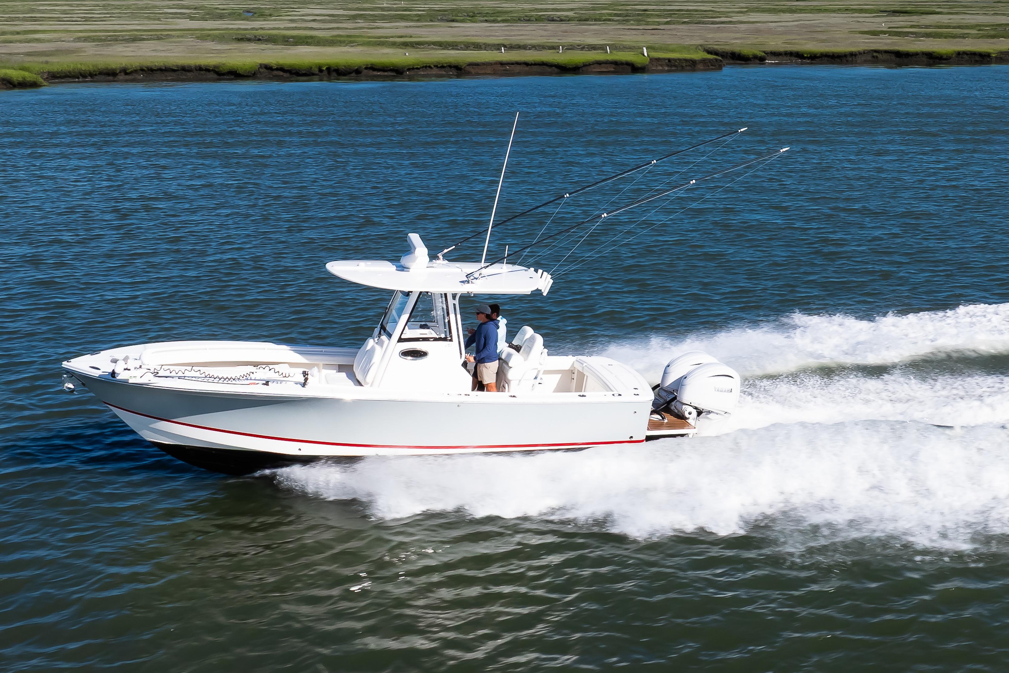2022 Regulator 28 Forward Seating boat cruising on open water.