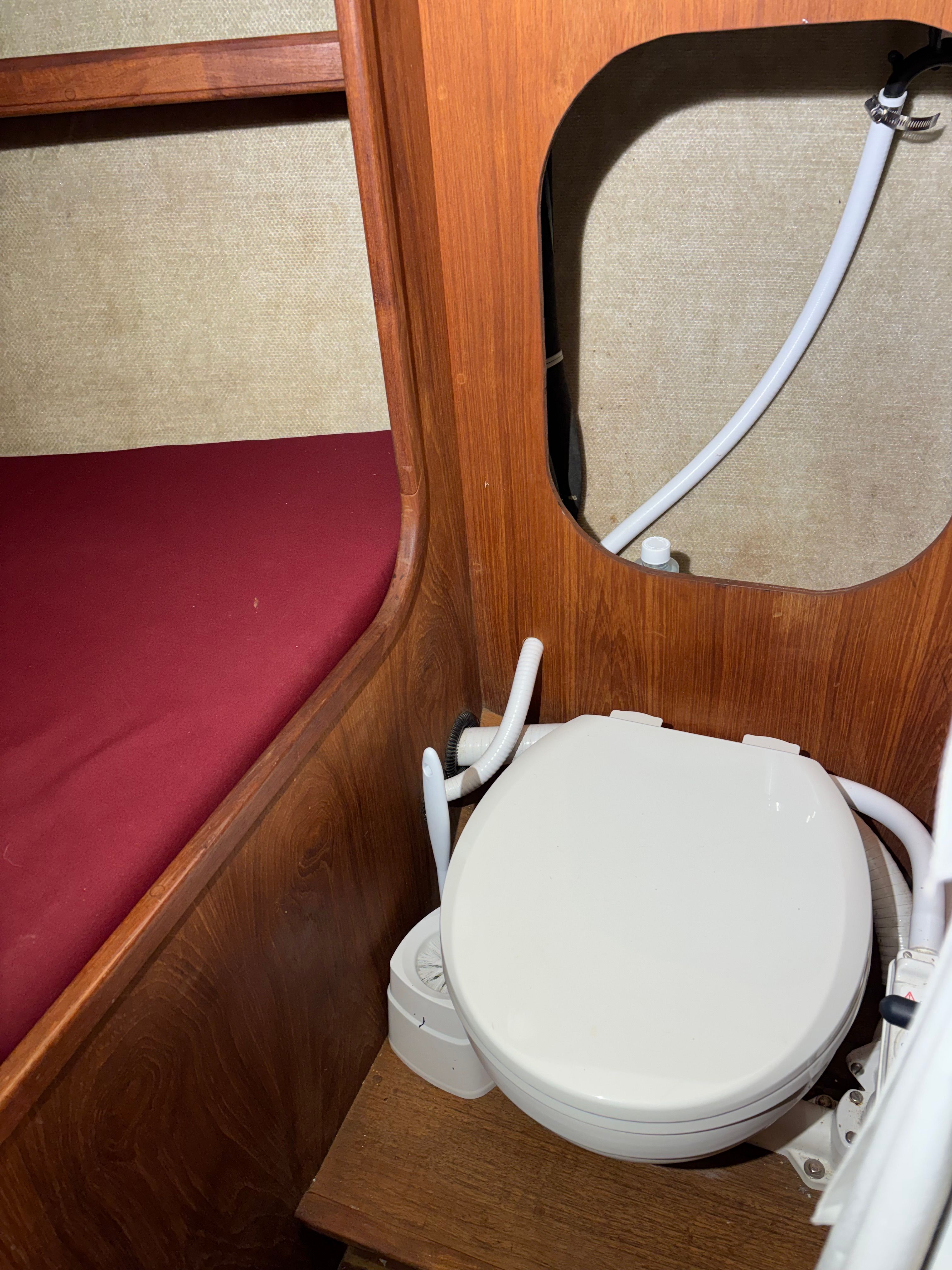 Interior of a 1986 Cape Dory 26 yacht with toilet.