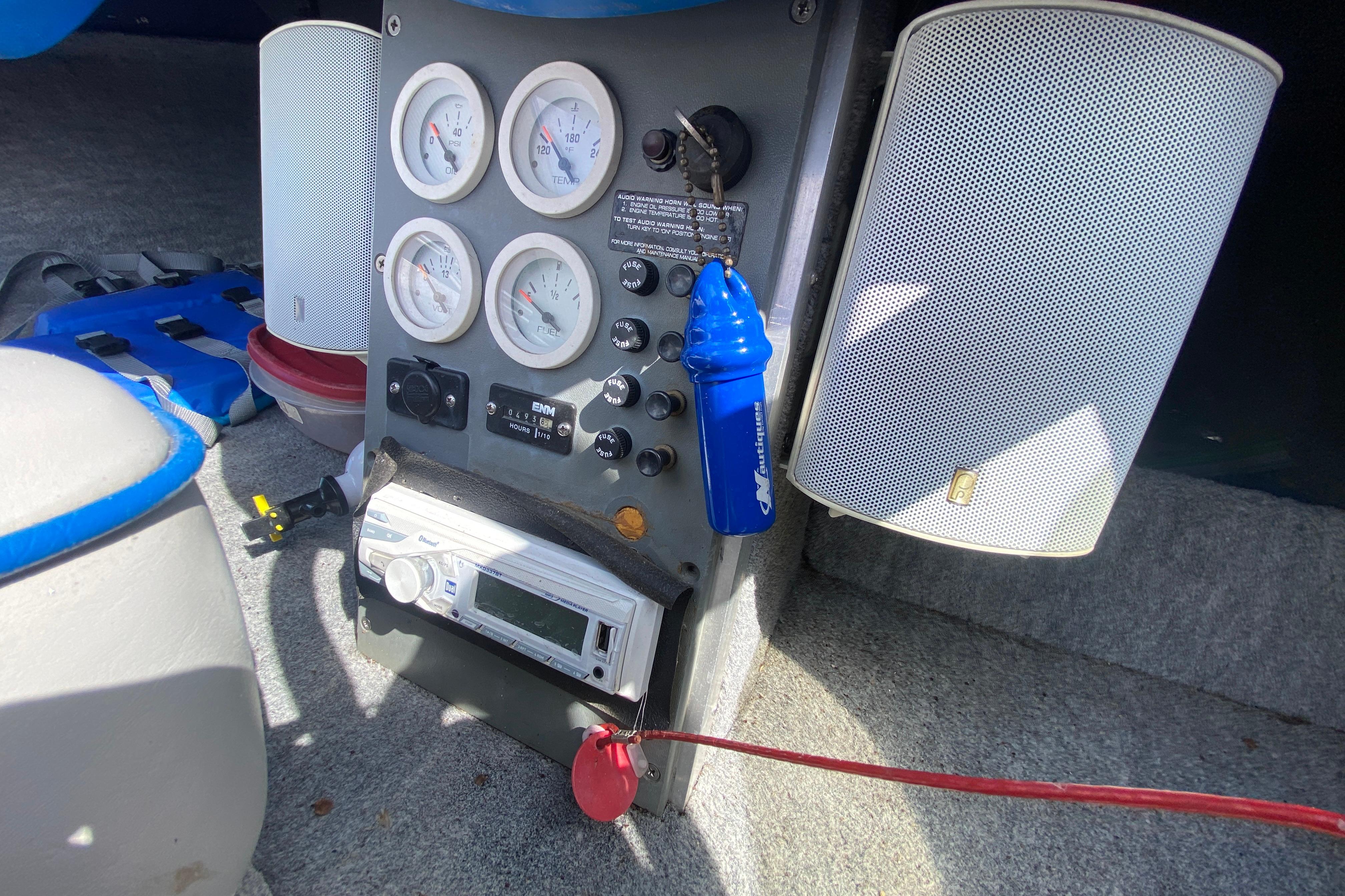 1997 Malibu Tantrum boat dashboard with gauges, stereo, and speakers.