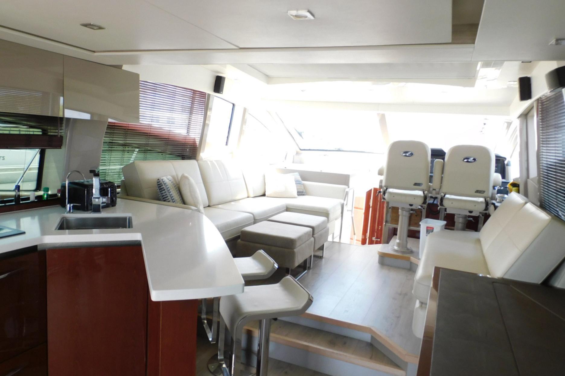 Luxurious interior of 2019 Sea Ray L550 yacht with modern seating and sleek design.