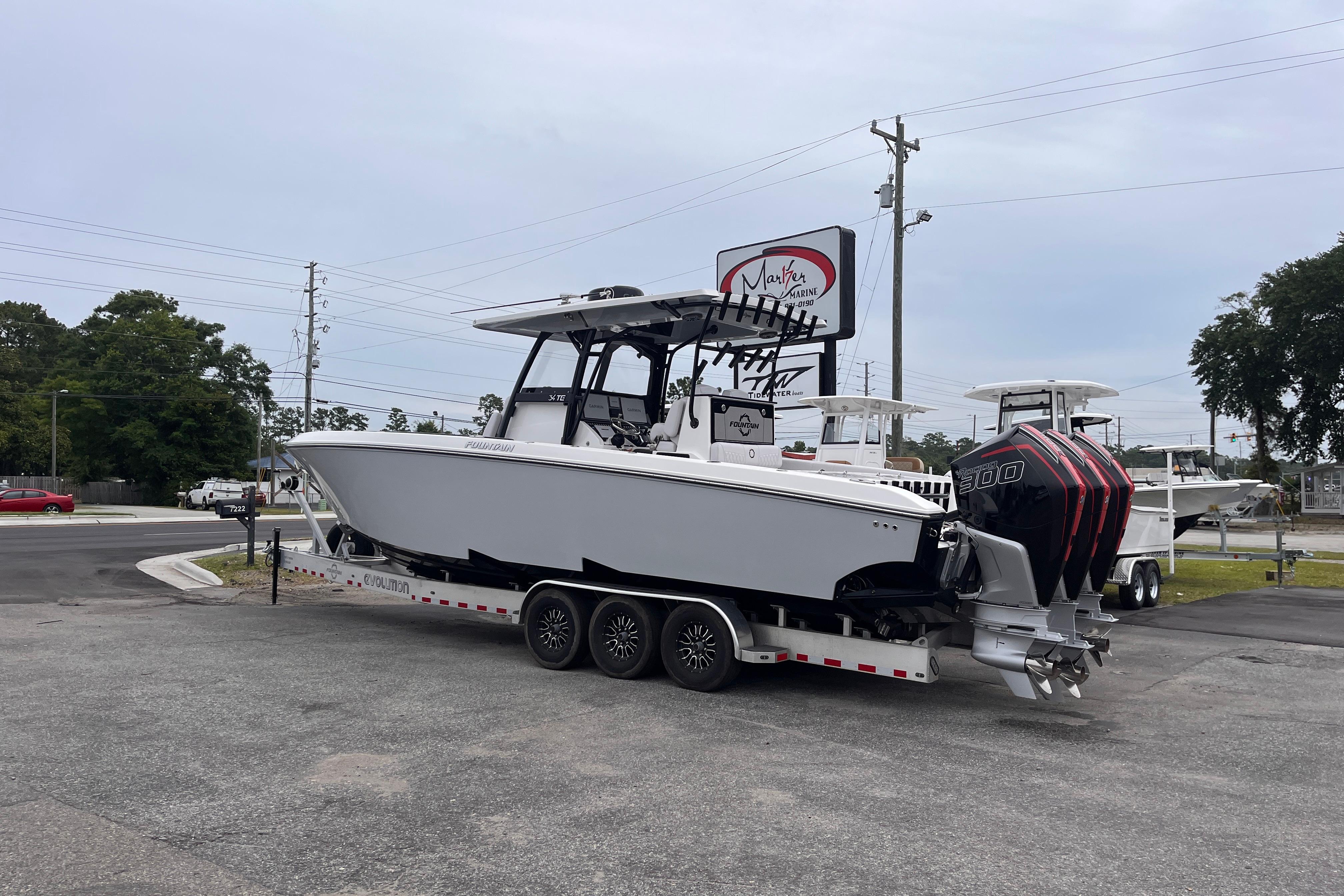 2024 Fountain 34 Tournament Edition boat on trailer, parked outdoors.