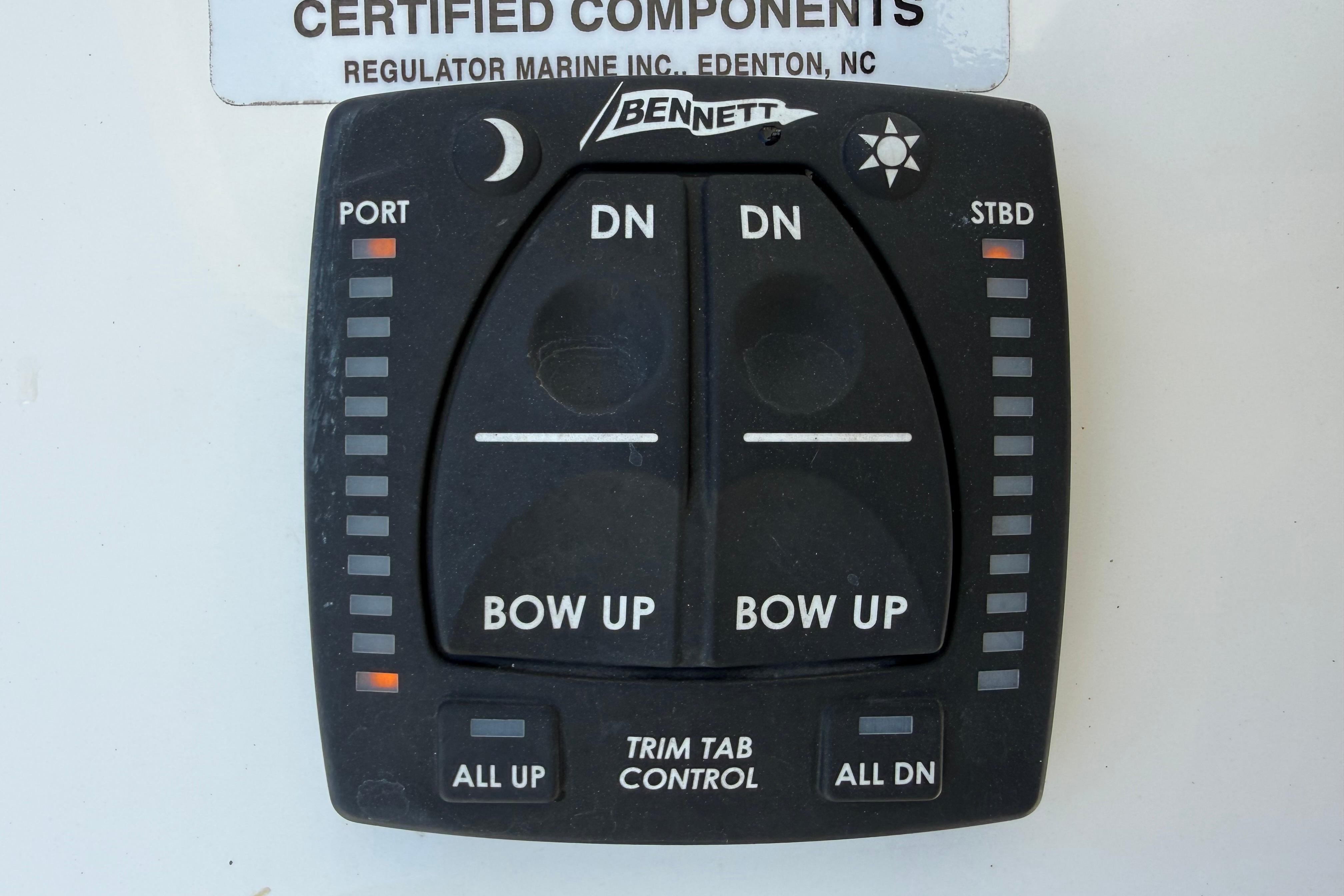 2023 Regulator 26XO trim tab control panel with Bennett branding.
