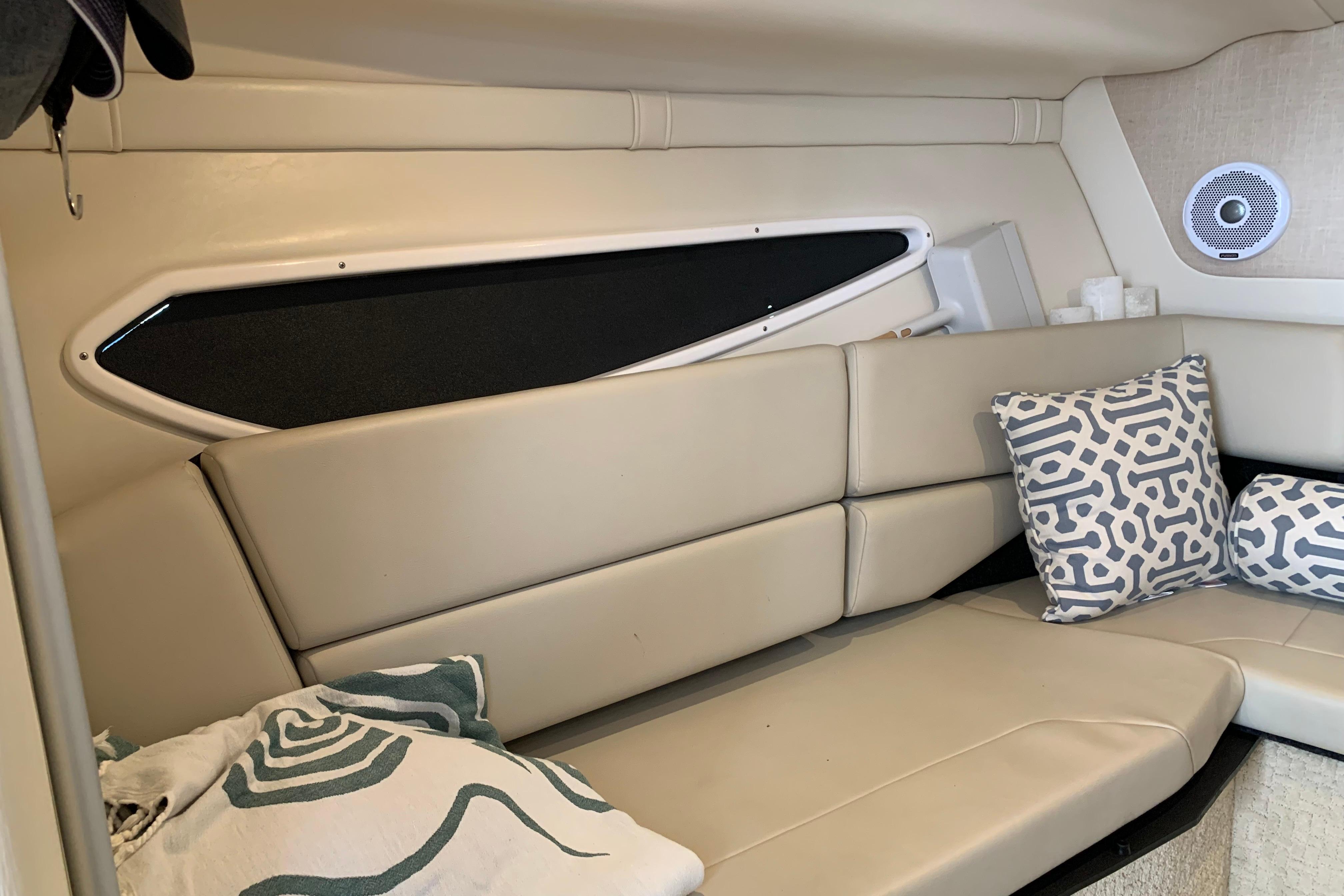 Interior of 2017 Regal 26 Express boat with beige seating and patterned cushions.