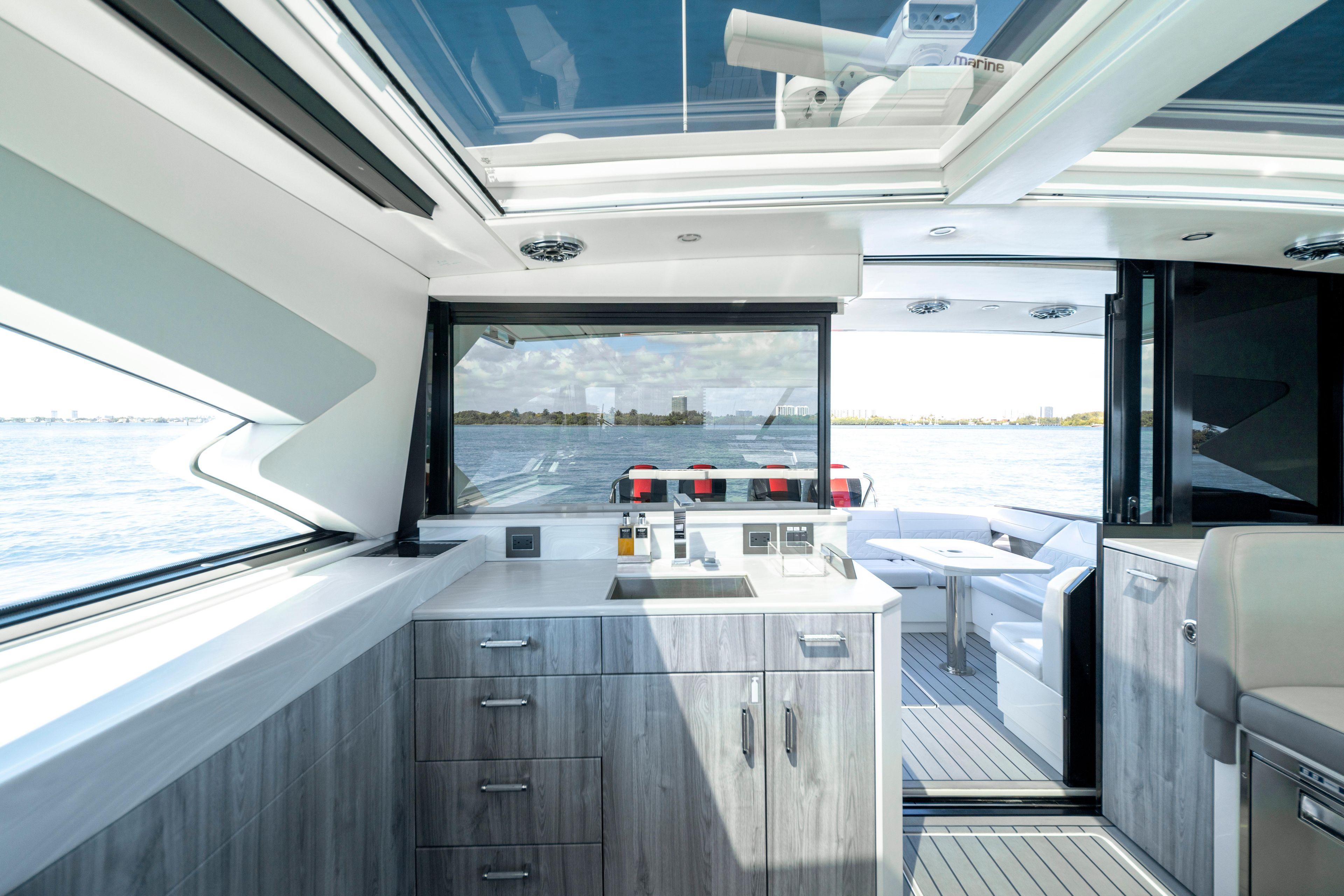 Interior of 2022 Formula 500 Super Sport Crossover yacht with modern kitchen and seating area.