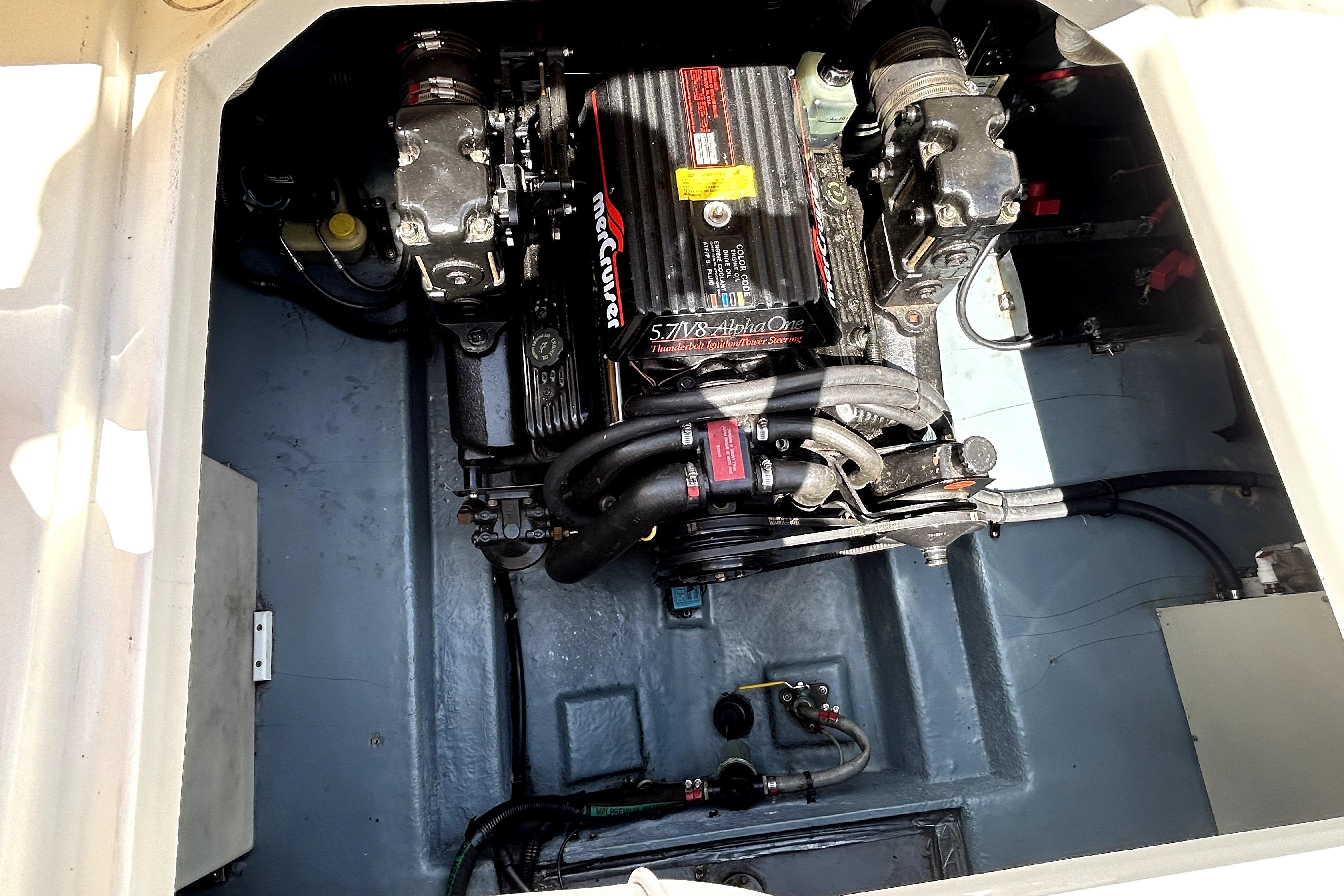 Engine compartment of a 1995 Sea Ray 250 Sundancer with MerCruiser 5.7L Alpha One.