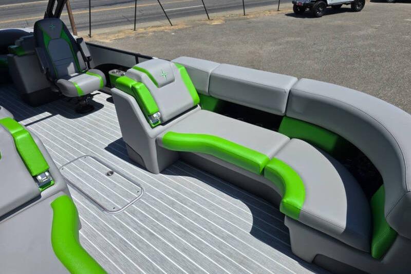 2026 Berkshire STS Arch Performance Series boat interior with gray and green seating.