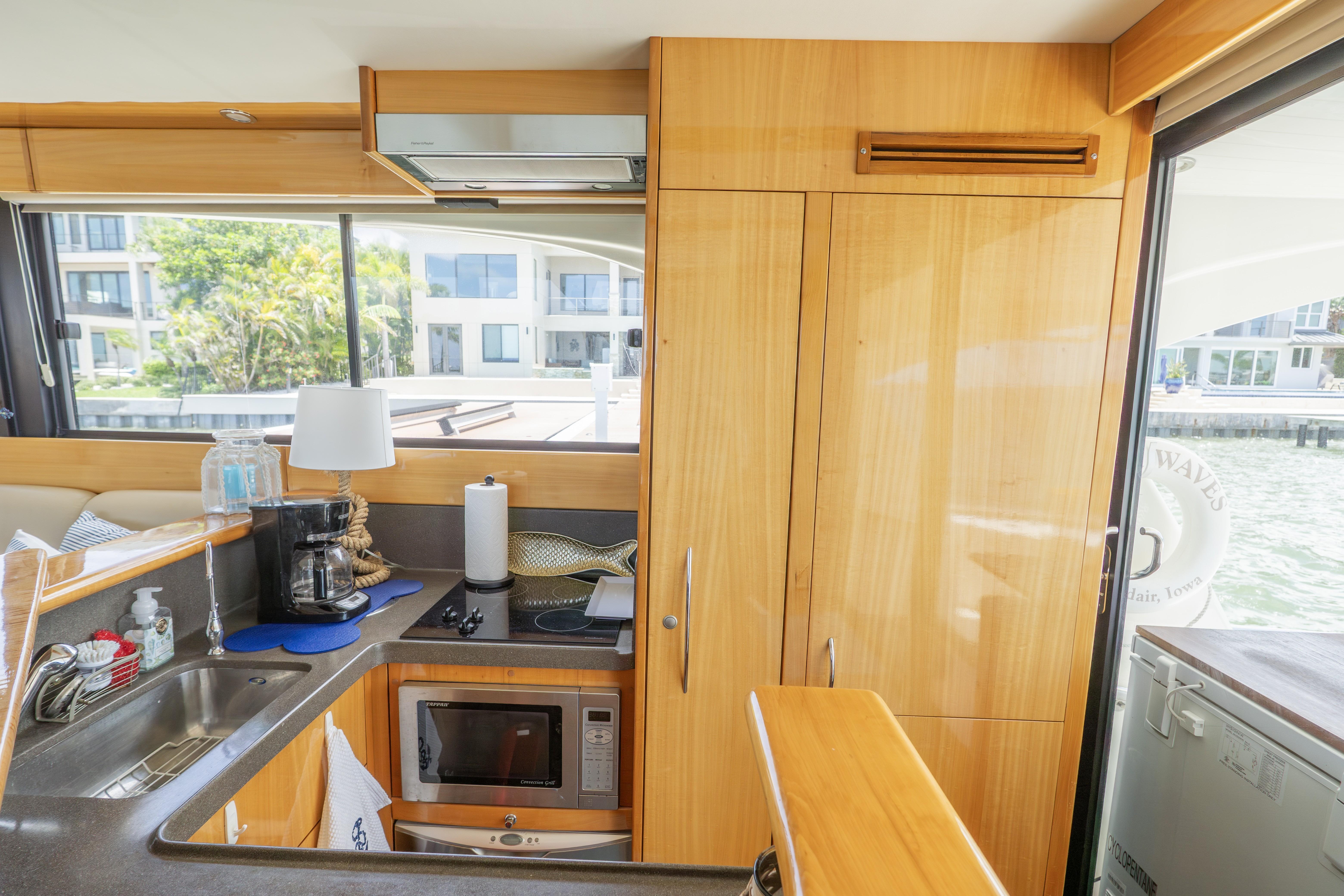 Interior of 2008 Maritimo 52 yacht kitchen with modern amenities and waterfront view.