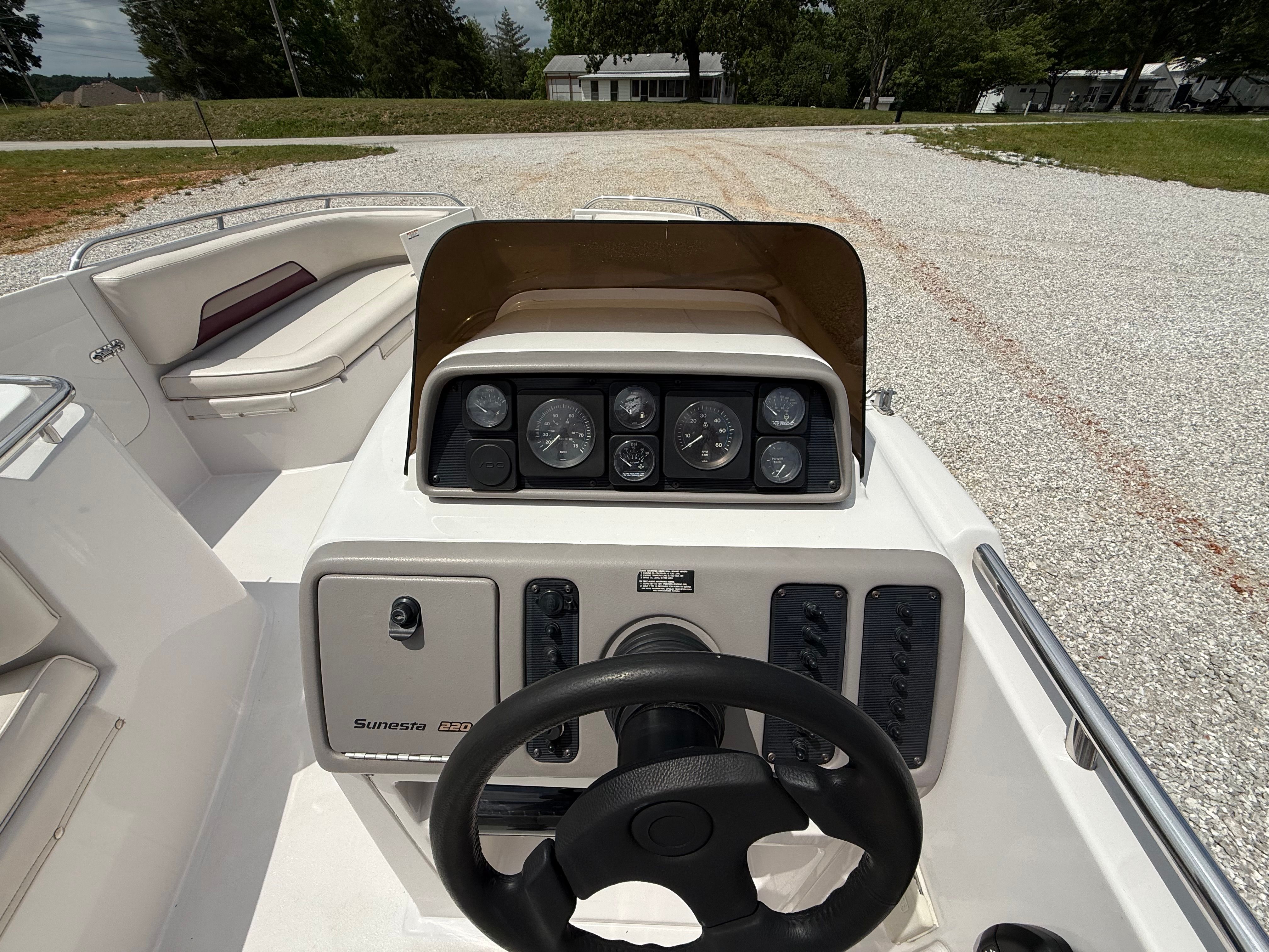 The image shows the cockpit of a 1994 Chaparral Sunesta 220 boat.