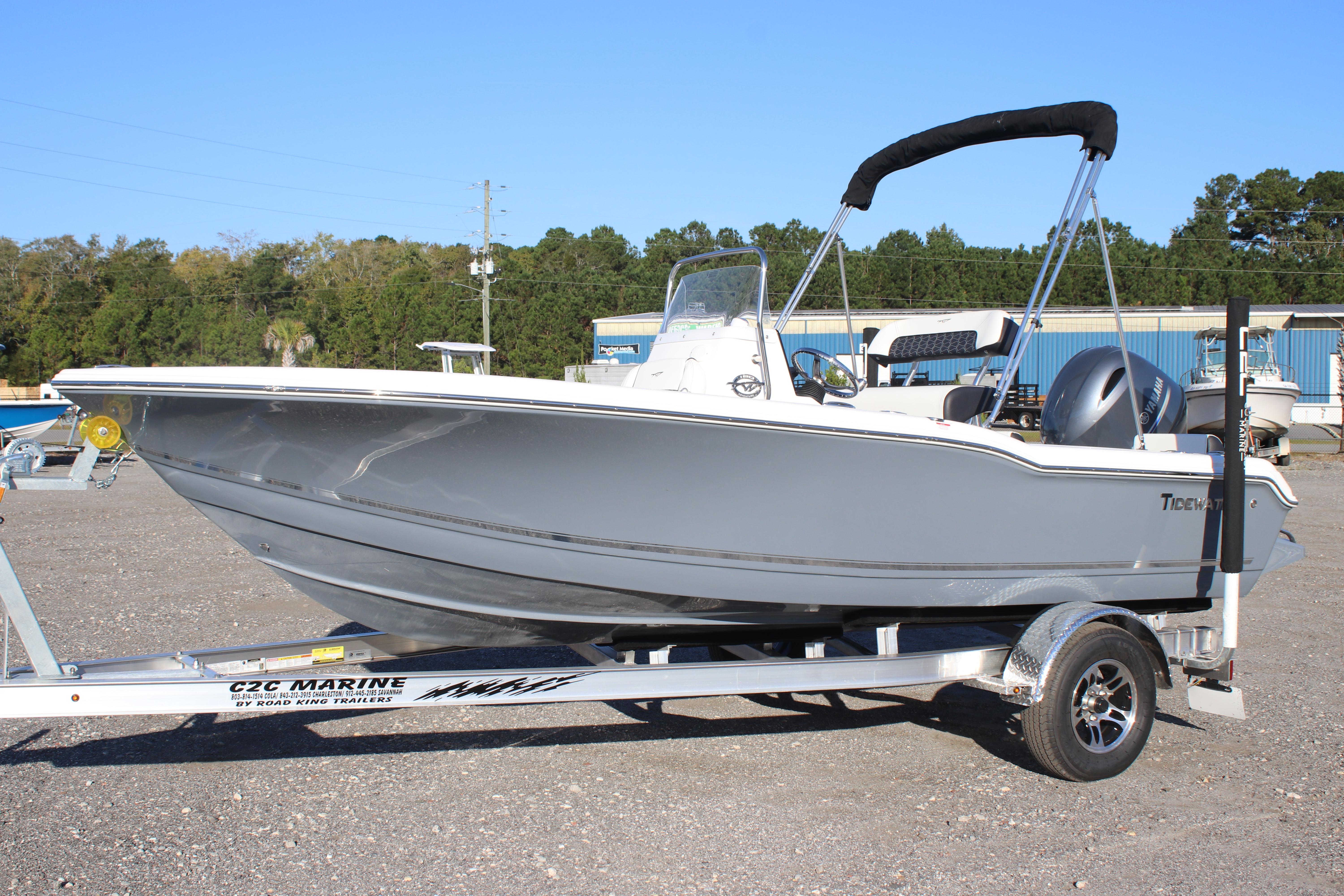 2026 Tidewater 180 CC Adventure boat on trailer, parked outdoors.