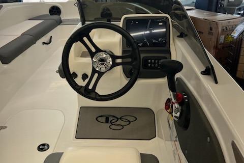 2025 Tahoe T21 boat interior with steering wheel and control panel.