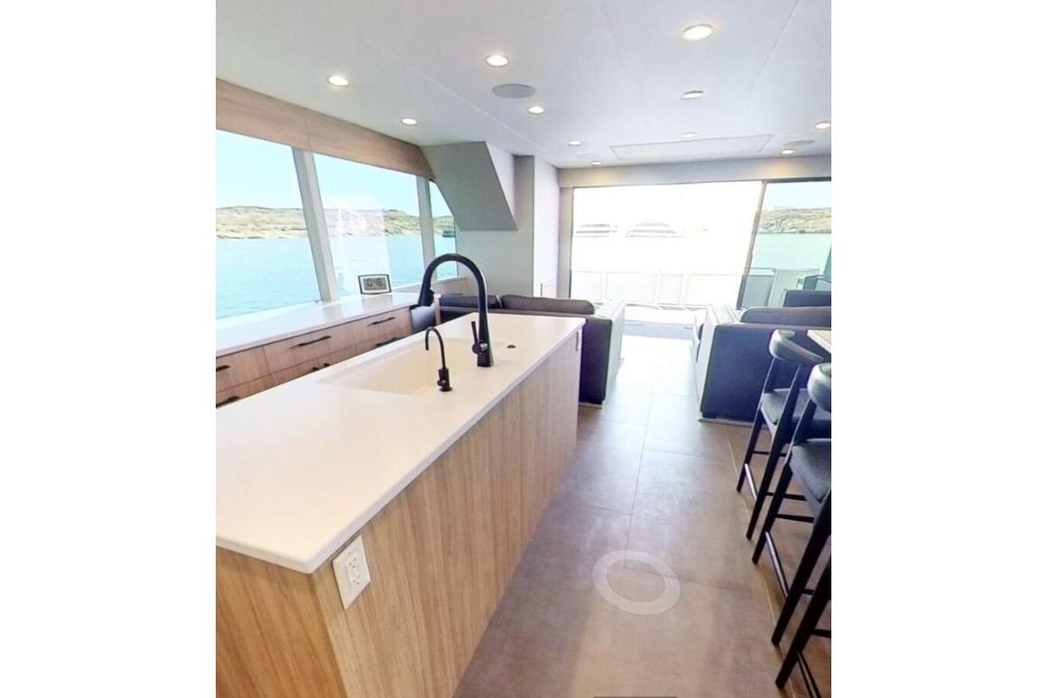 Modern kitchen interior on Adonia's Galileo Trip #1, featuring sleek design and scenic views.