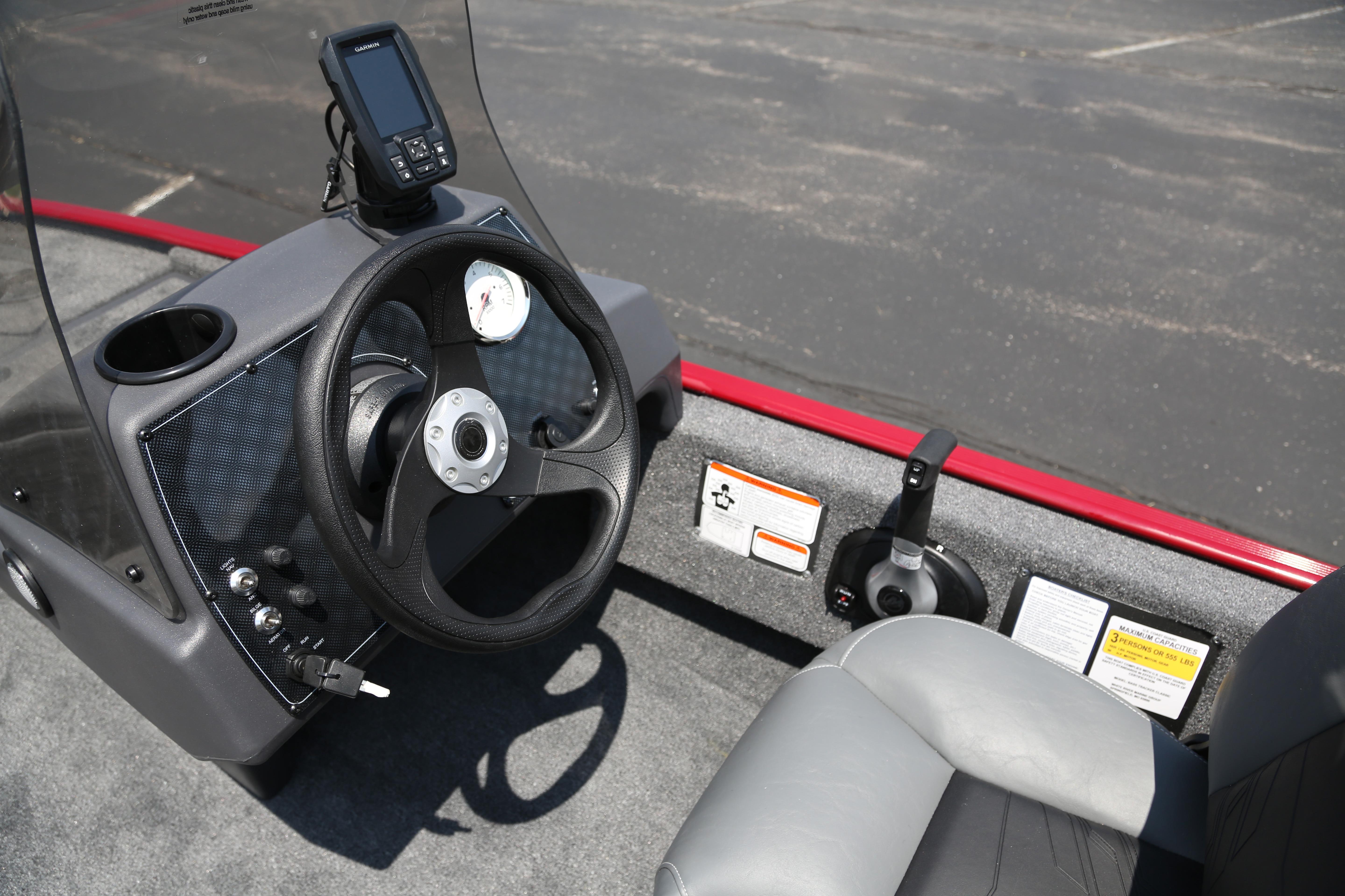 2026 Tracker Bass Tracker Classic XL boat dashboard with steering wheel and control panel.