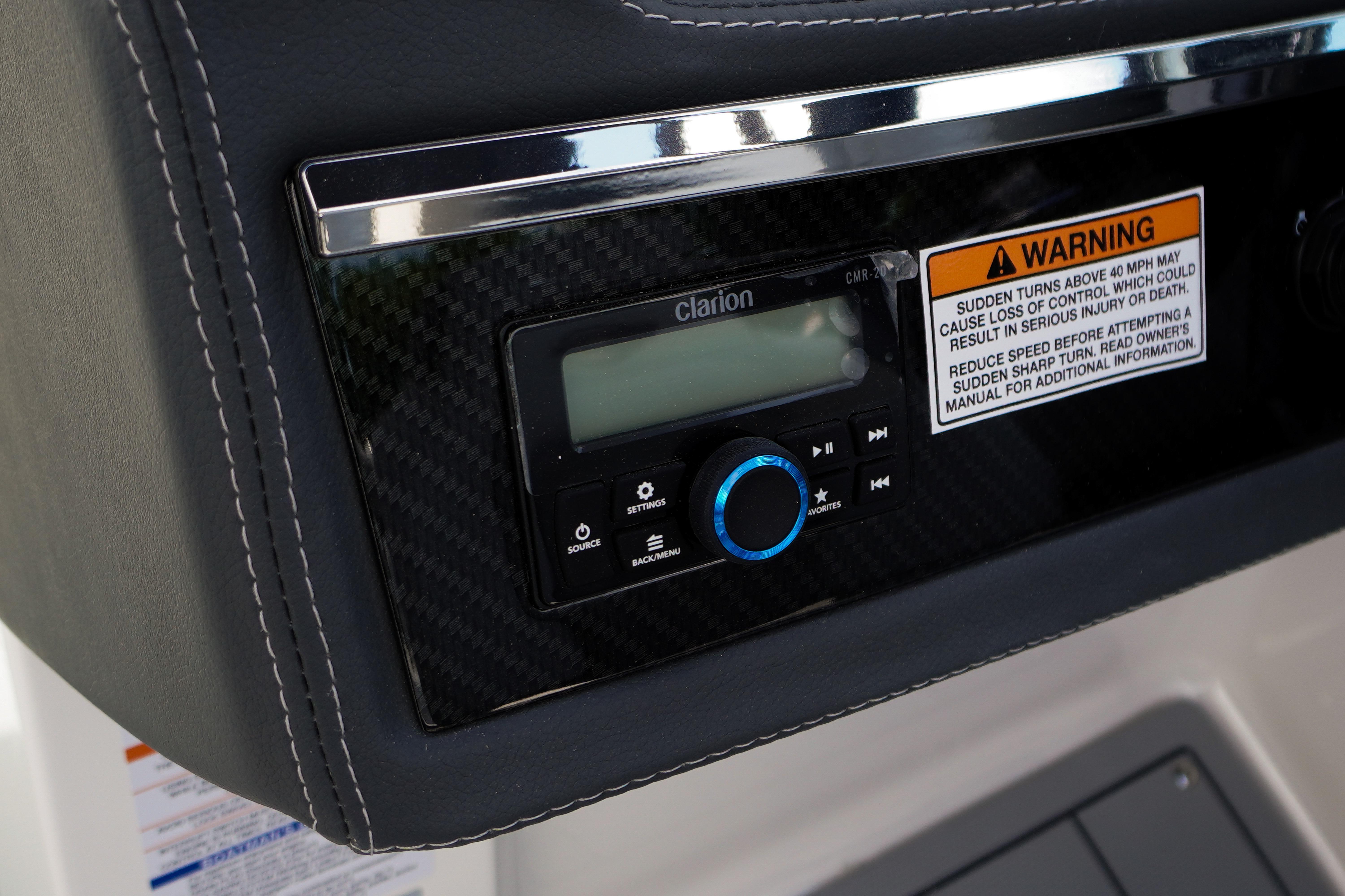 2026 Chaparral SSX 4 dashboard with Clarion audio system and safety warning label.