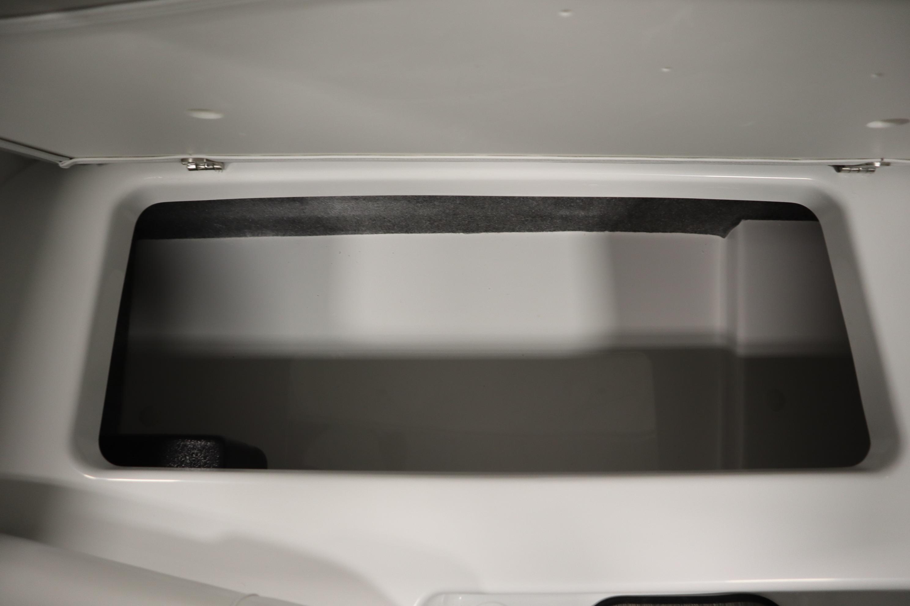 2026 Four Winns H1 Freedom boat storage compartment, open and empty.