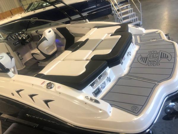 2023 Chaparral 21 Surf boat interior with sleek seating and modern dashboard.