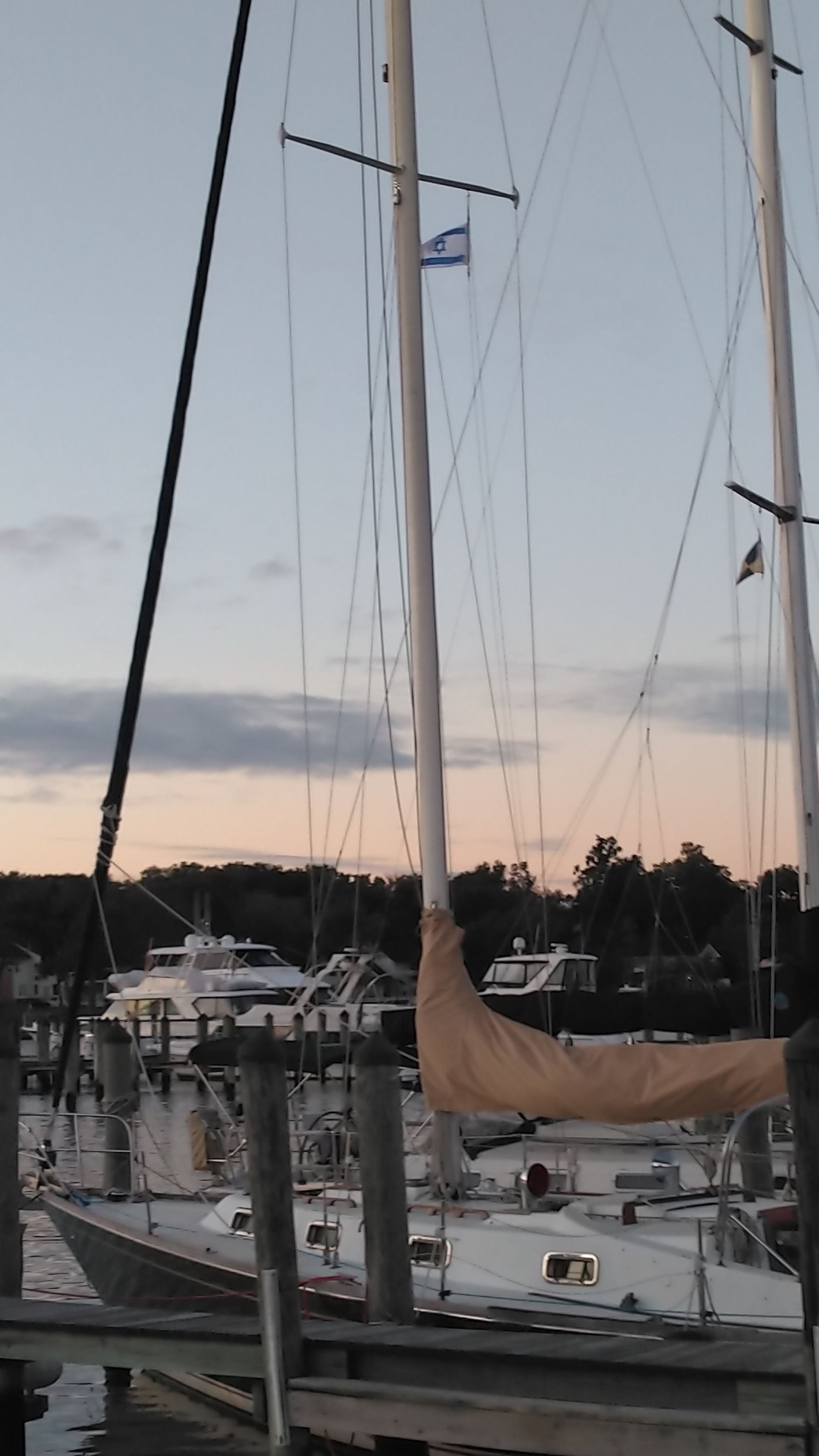 1978 Tartan 37 sailboat docked at sunset harbor.