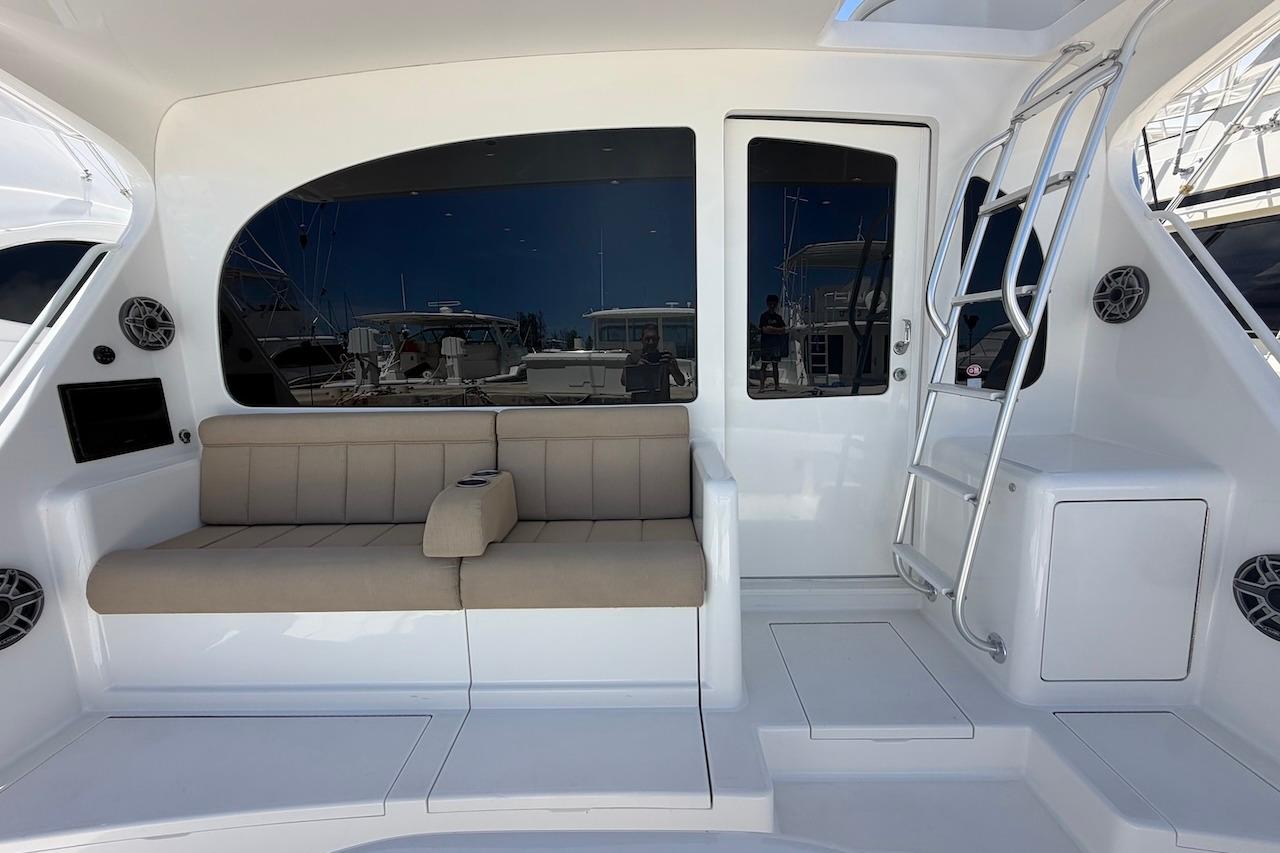 Luxurious 2012 Viking 50 Convertible yacht interior with seating and ladder.