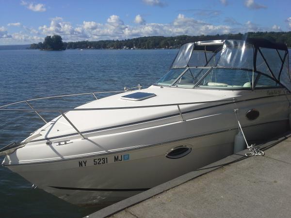 2004 Rinker Fiesta Vee 250 boat docked.