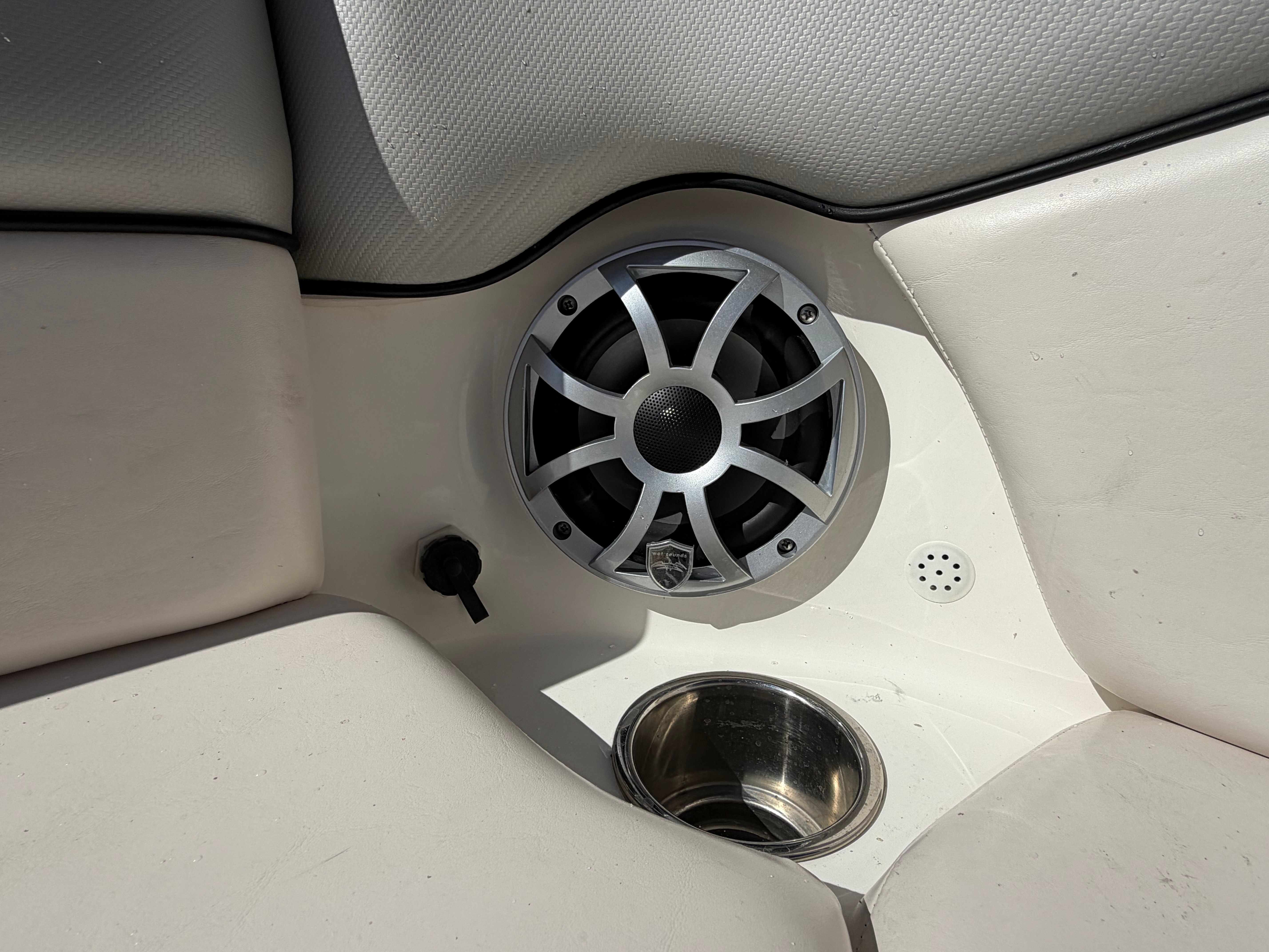 Speaker and cup holder on Yamaha AR240 HO boat.