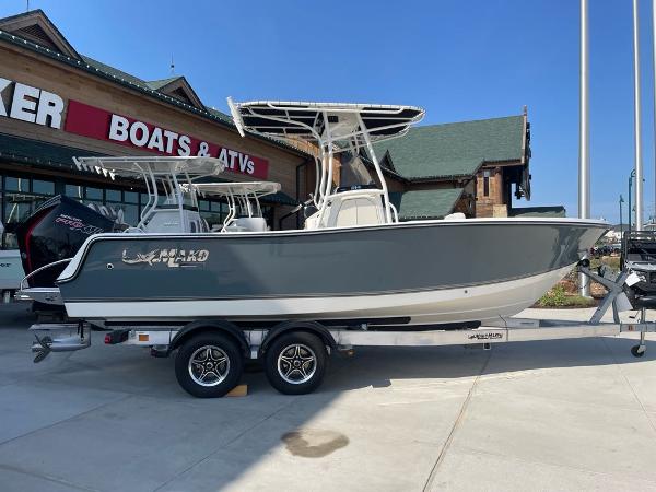 2024 Mako 214 CC boat on trailer outside dealership.