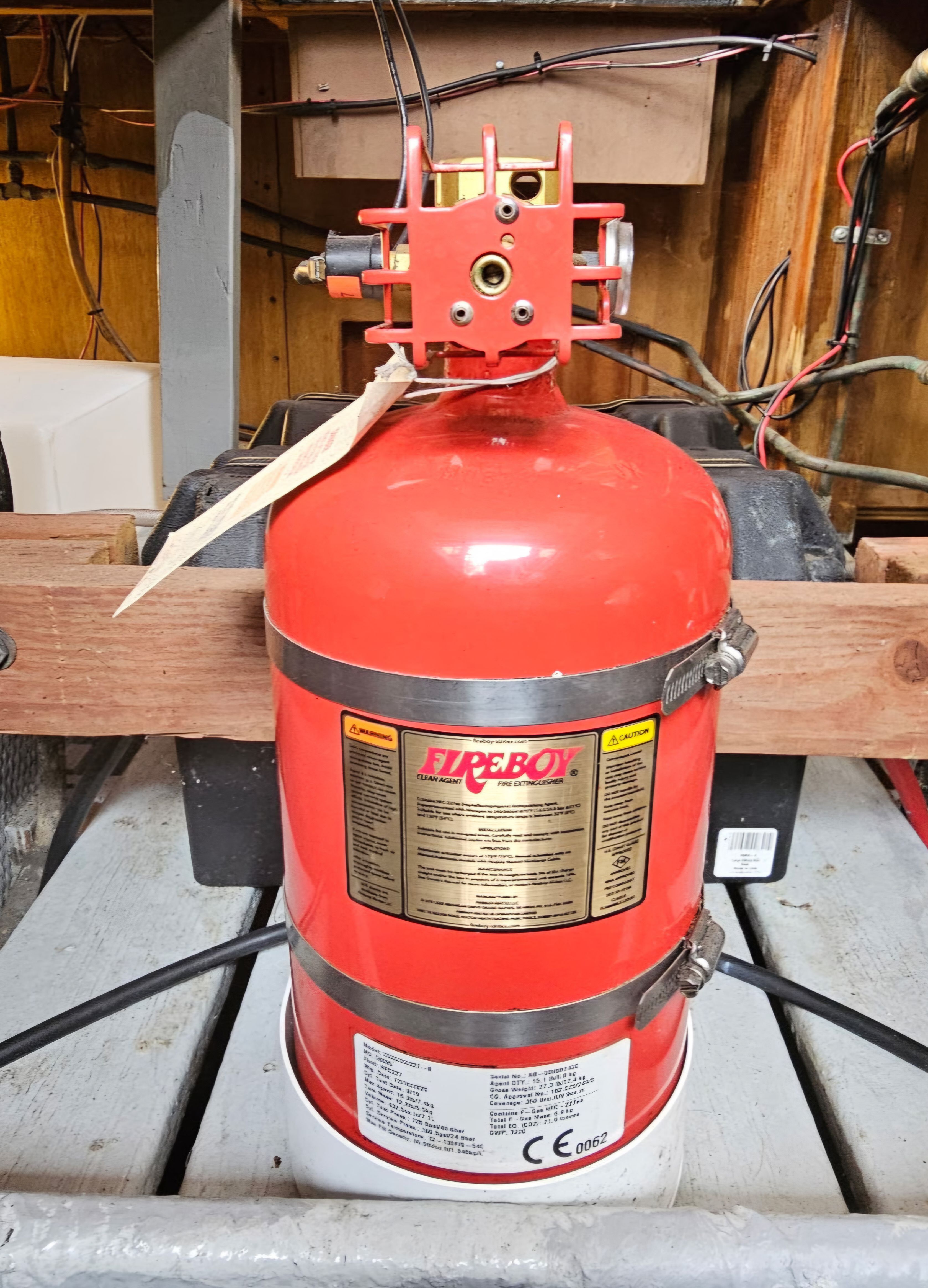 Fire extinguisher in engine room of 1976 Egg Harbor 33 Sportfisher.