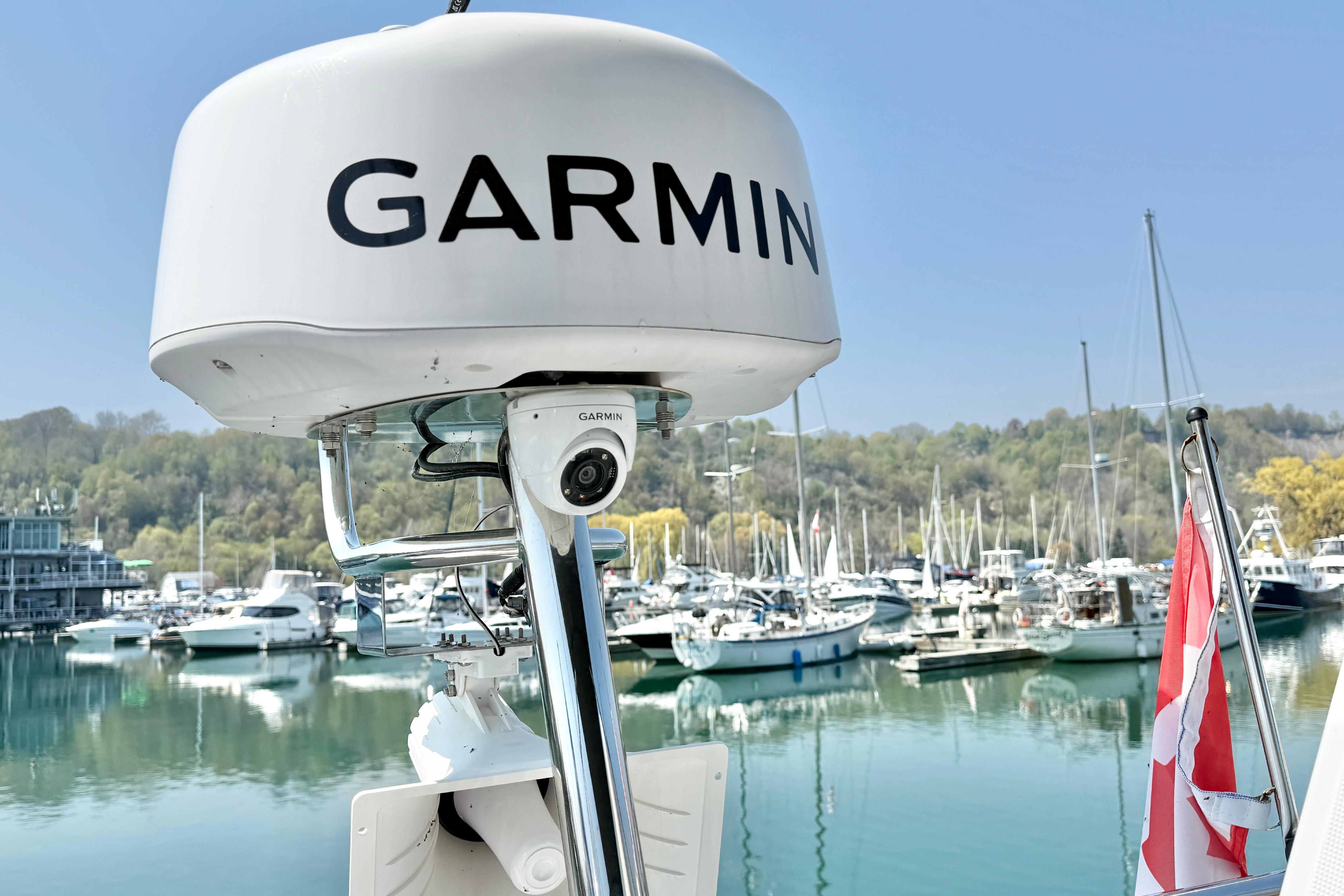 Garmin radar on Jeanneau NC 1095 Fly 2022, docked at a marina with boats.