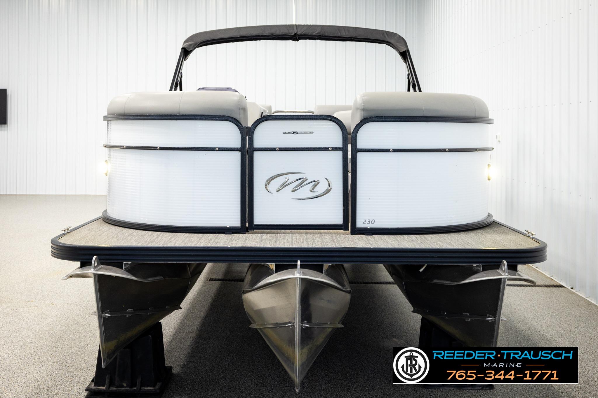 2019 Manitou Oasis SR VP pontoon boat in showroom, front view.
