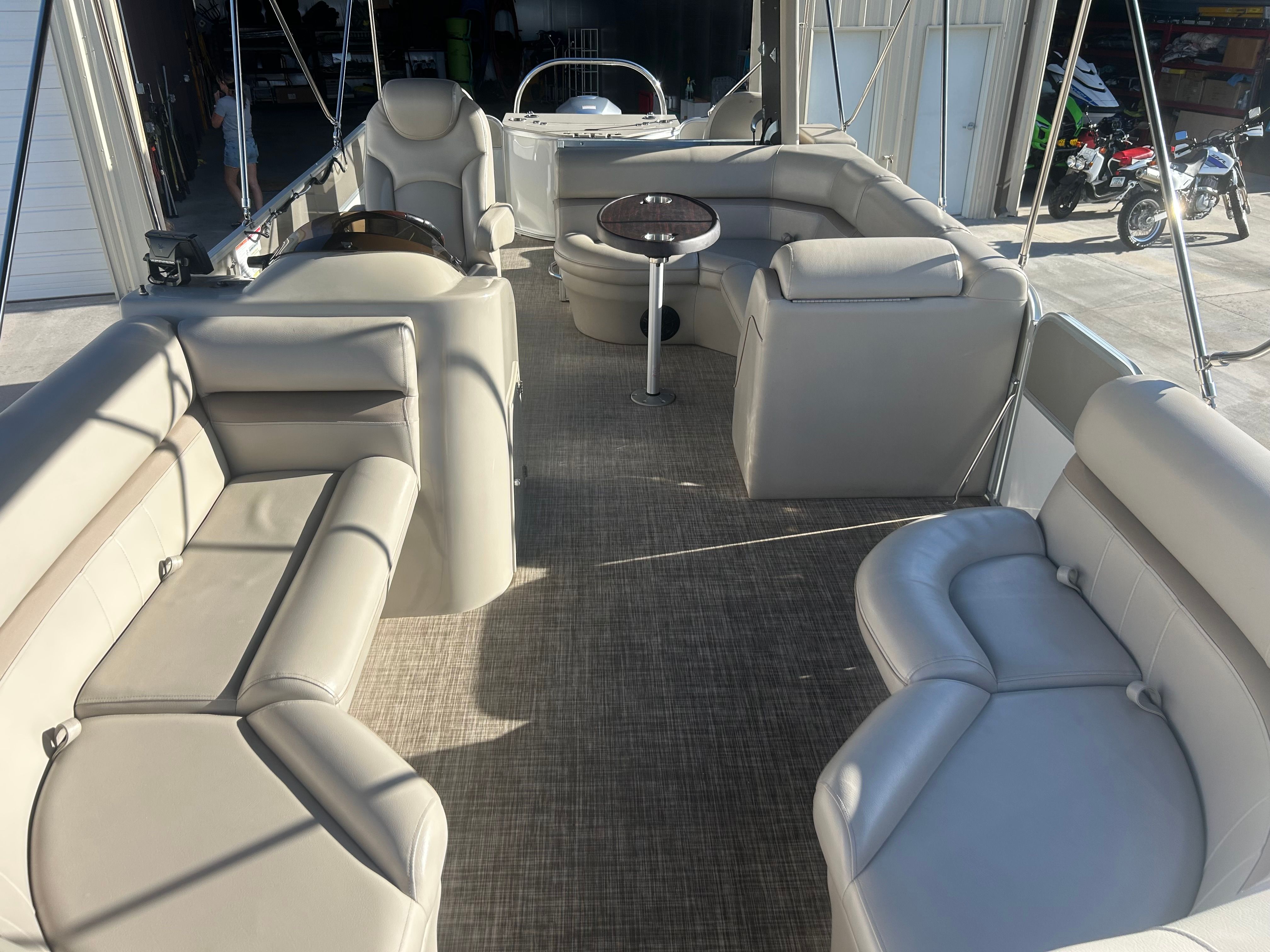 The image shows the spacious deck of a 2018 Berkshire 24RFX CTS pontoon boat with comfortable seating.