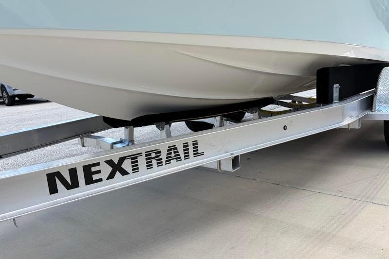 2025 Key West 210 Bay Reef boat on Nextrail trailer, close-up view.