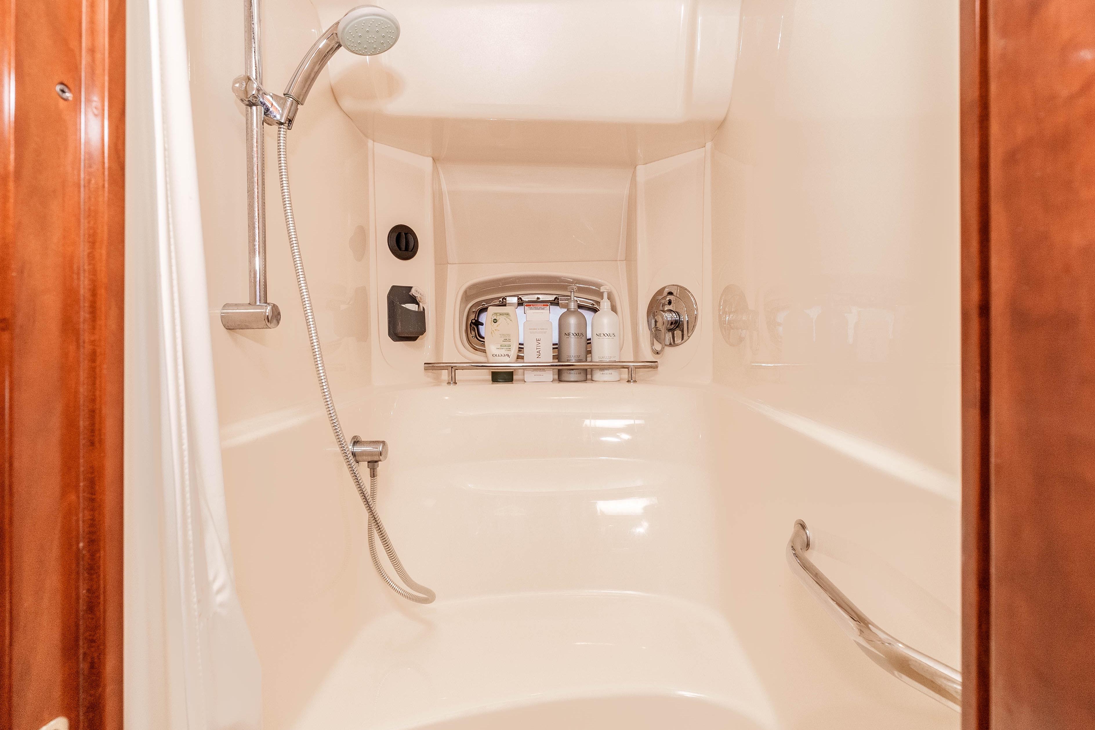 Luxurious shower in 2007 Sea Ray 48 Sundancer yacht with modern fixtures.