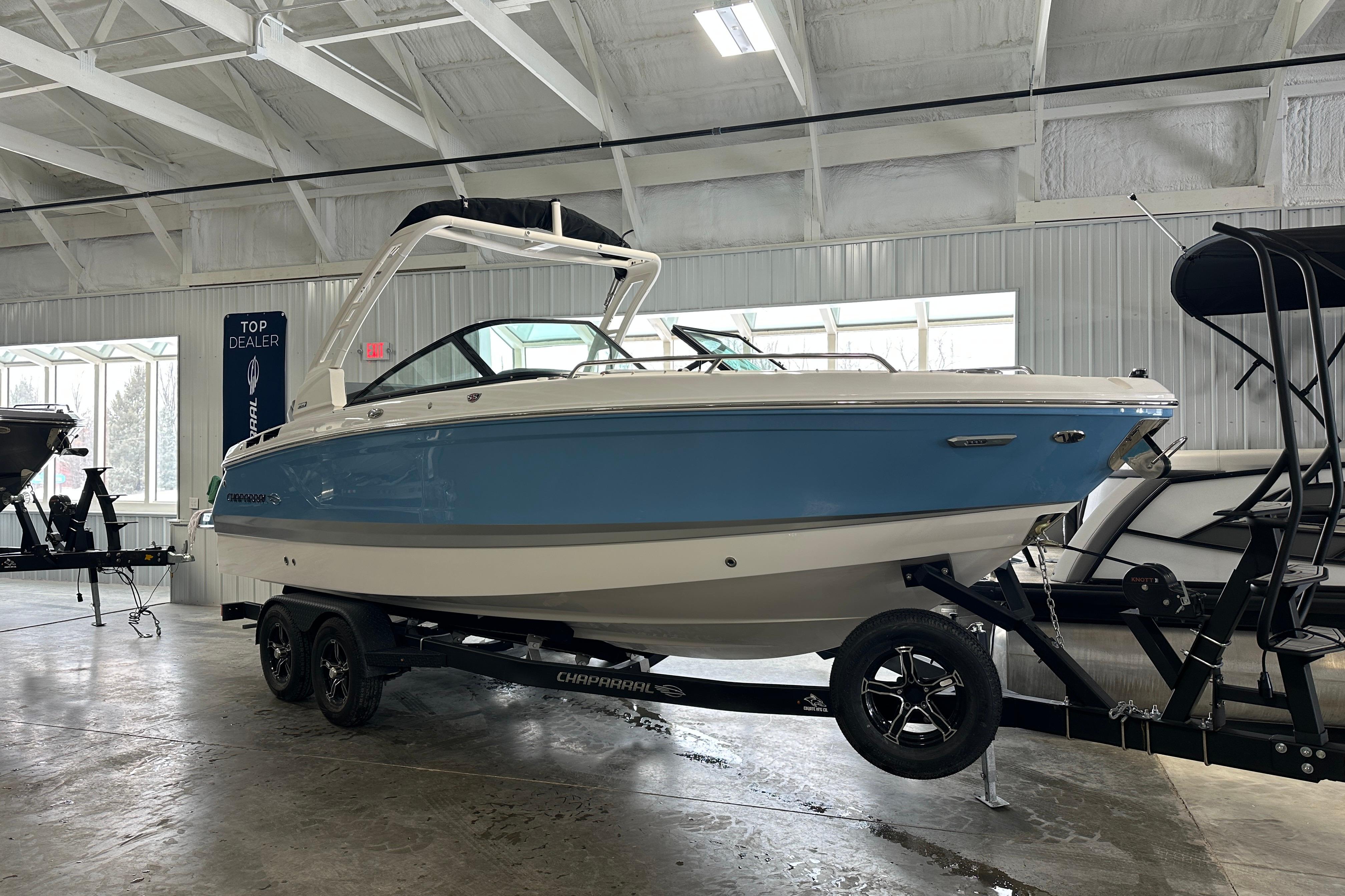 2026 Chaparral SSX 6 boat in a showroom.