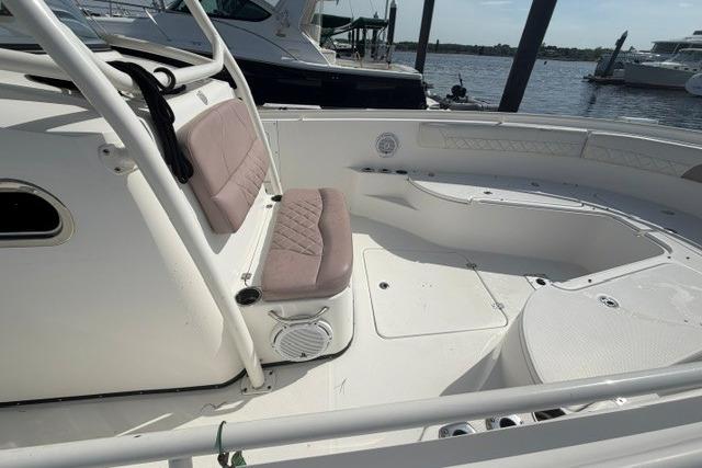 2014 Edgewater 318CC boat interior with seating, docked by the water.