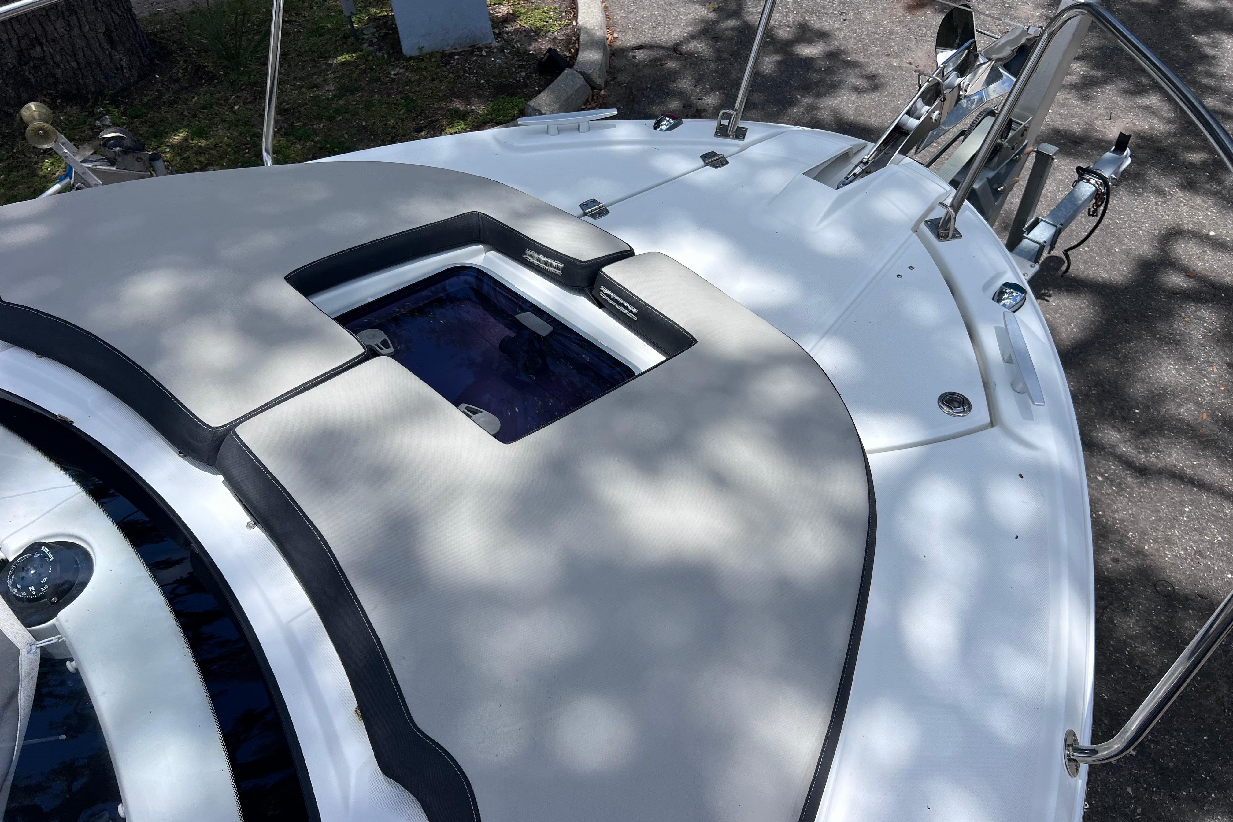 2021 Jeanneau NC Weekender 795 Series 2 boat deck with hatch and railing.