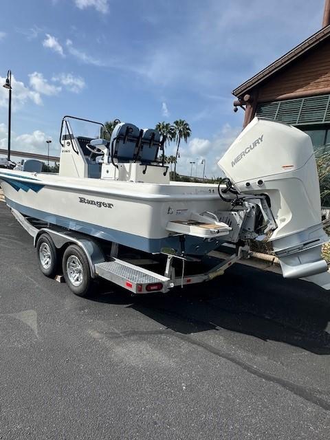 2025 Ranger 2360 Bay boat on trailer with Mercury outboard engine.