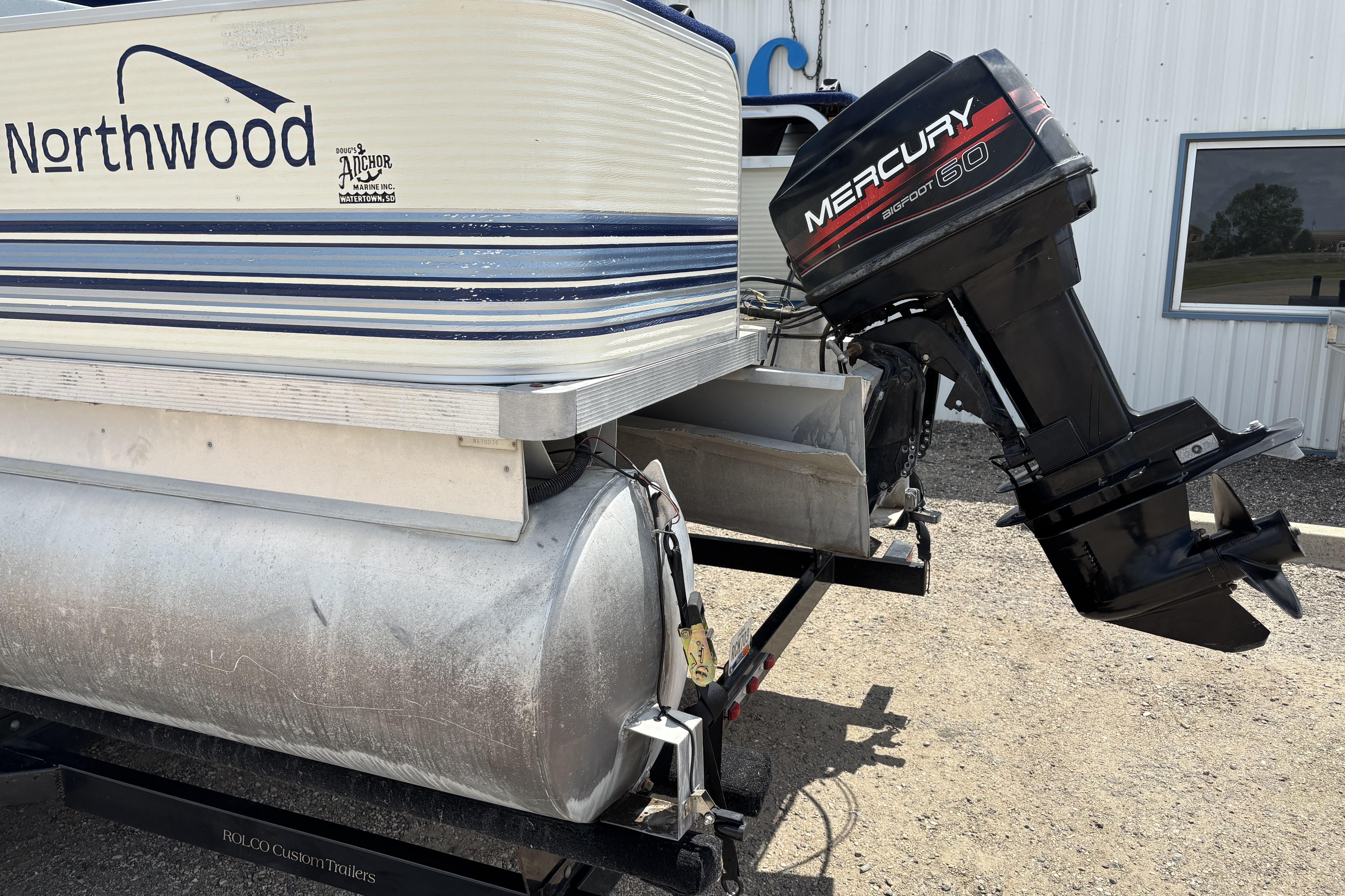 1997 Northwood 24' Pontoon with Mercury 60 outboard motor on trailer.