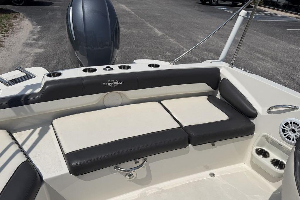 2019 Stingray 201 DS boat interior with cushioned seating and cup holders.