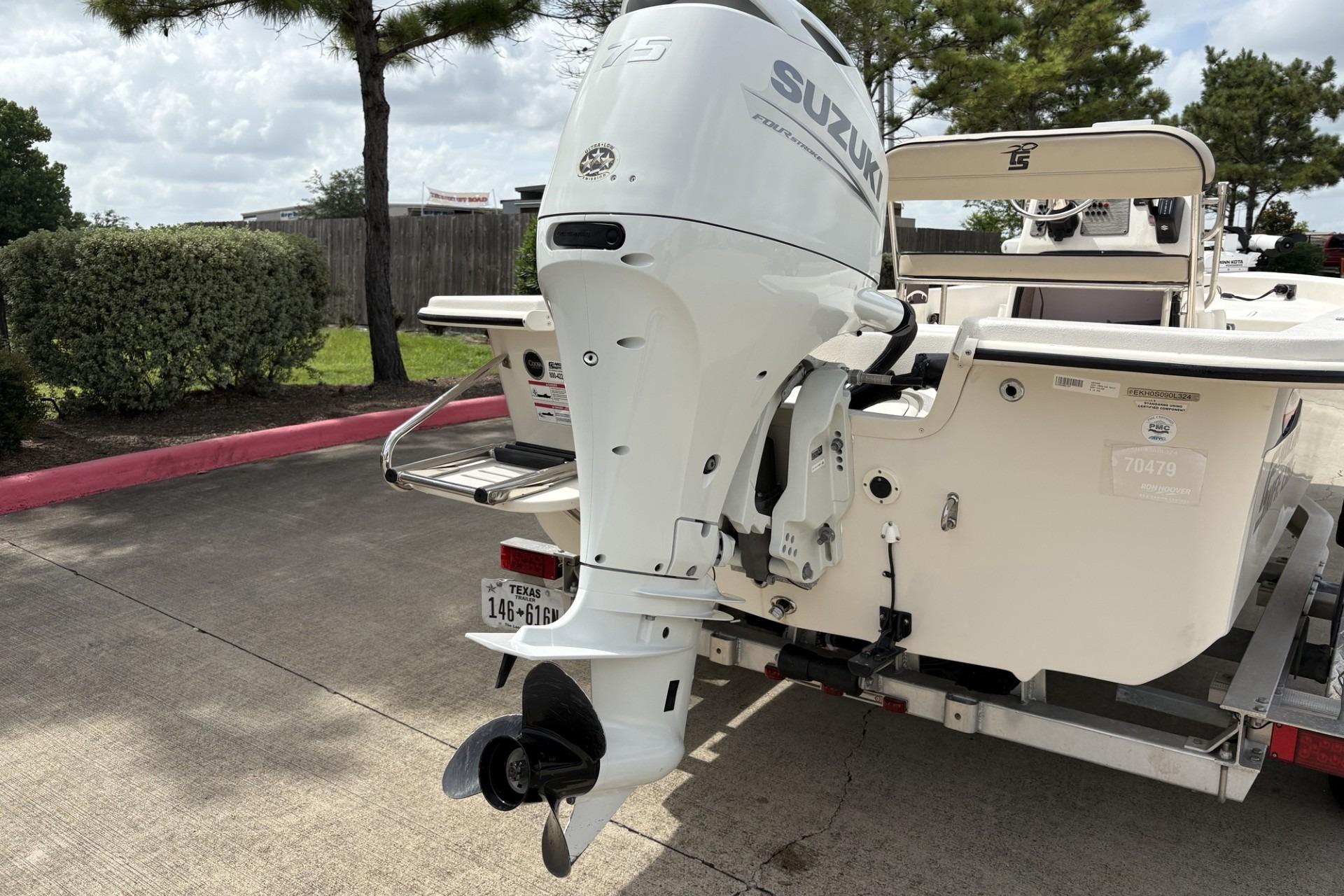 2024 Carolina Skiff E18 JVX CC with Suzuki outboard motor on trailer.