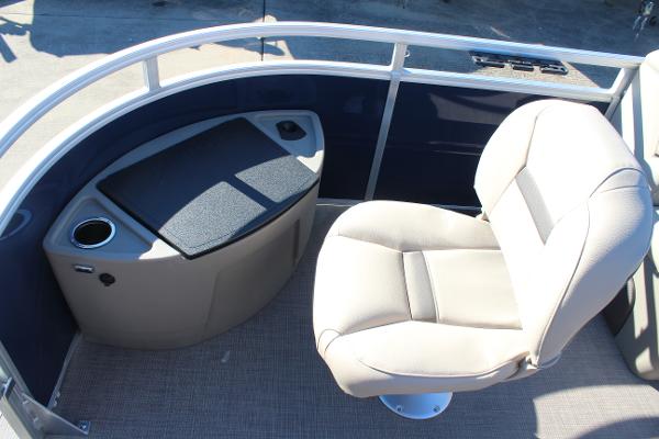 2025 Sun Tracker Fishin' Barge 22 DLX interior with seating and storage.