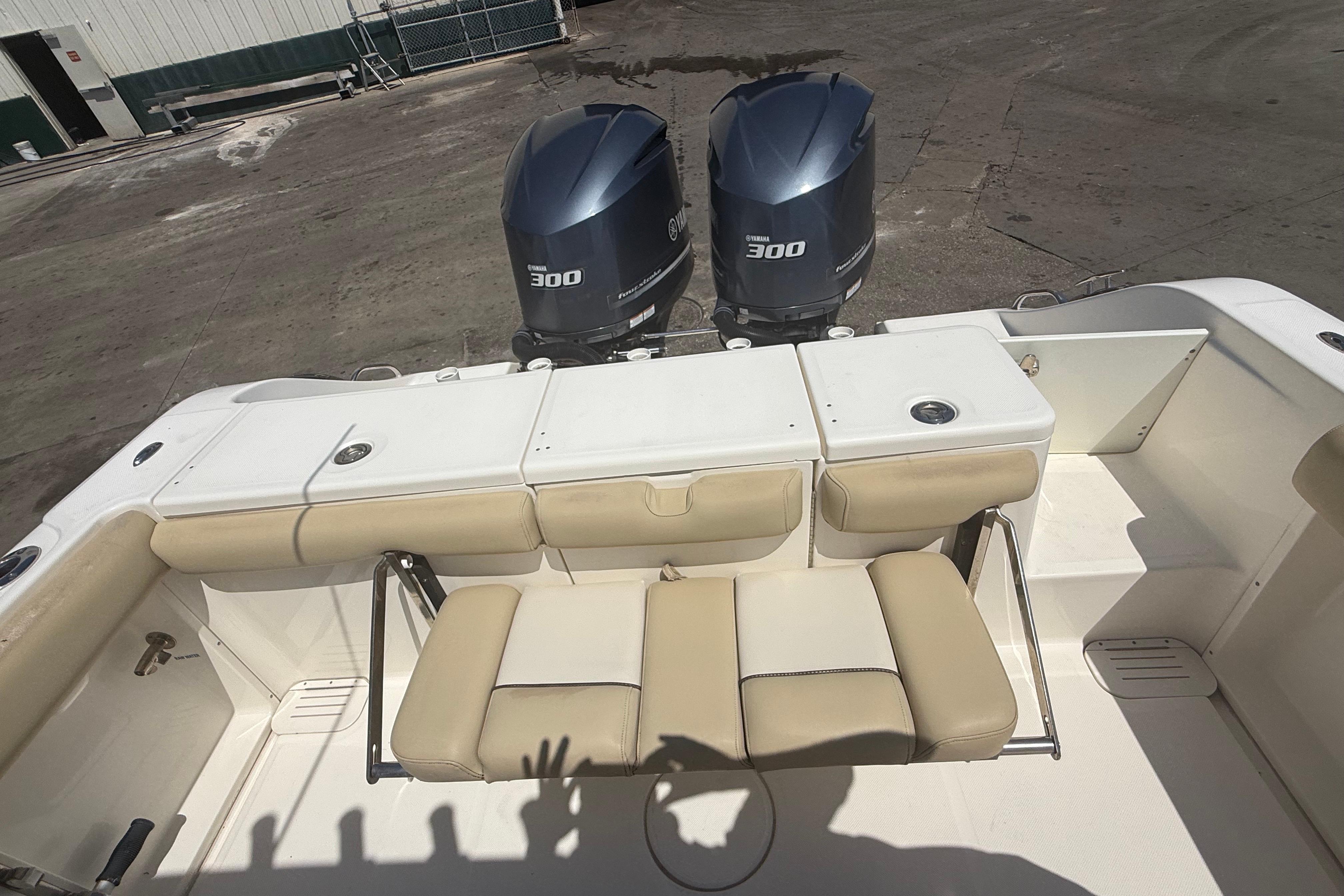 2019 Key West Billistic 281 Center Console with twin Yamaha 300 engines, beige seating.