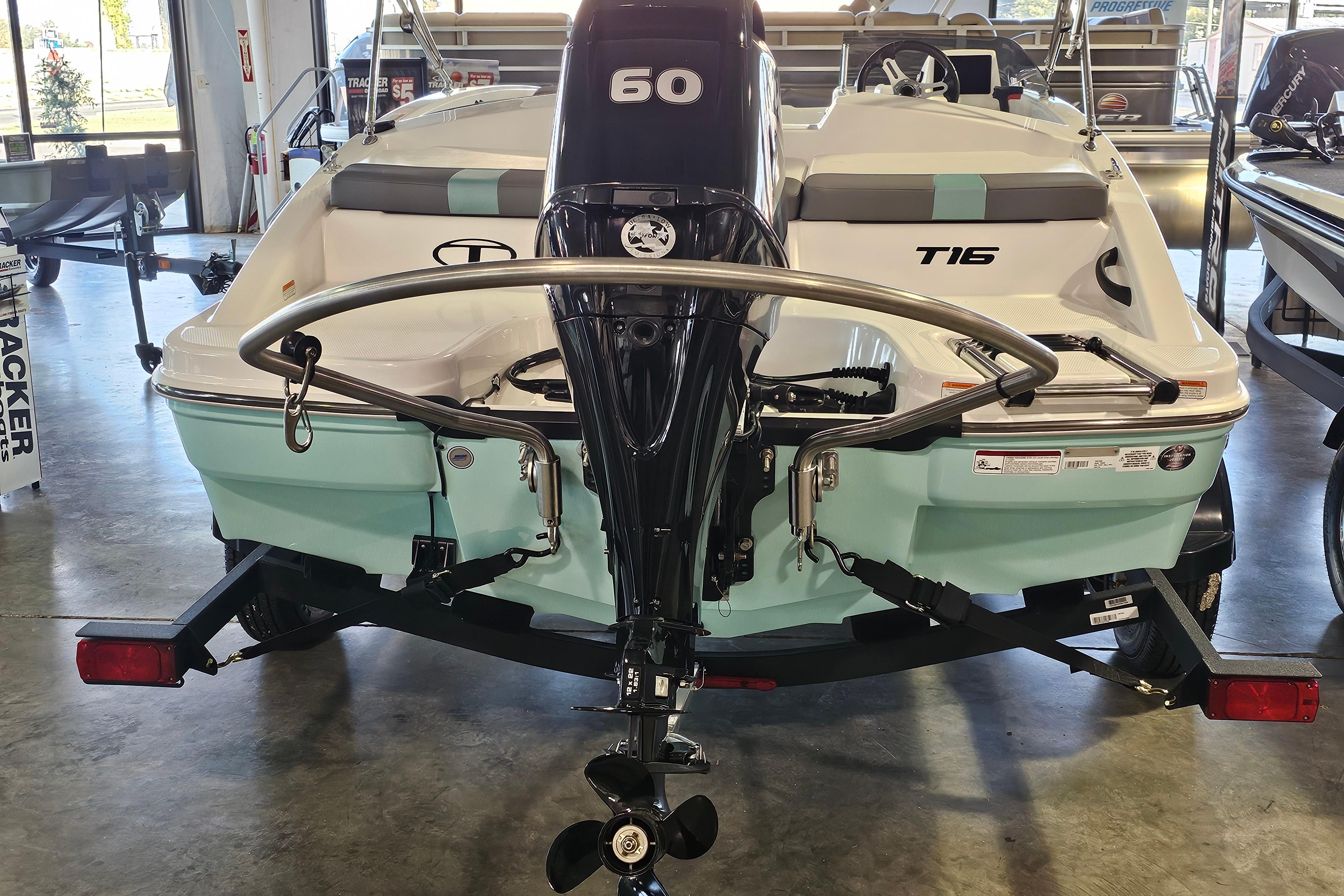 2026 Tahoe T16 boat with 60 HP engine in showroom display.