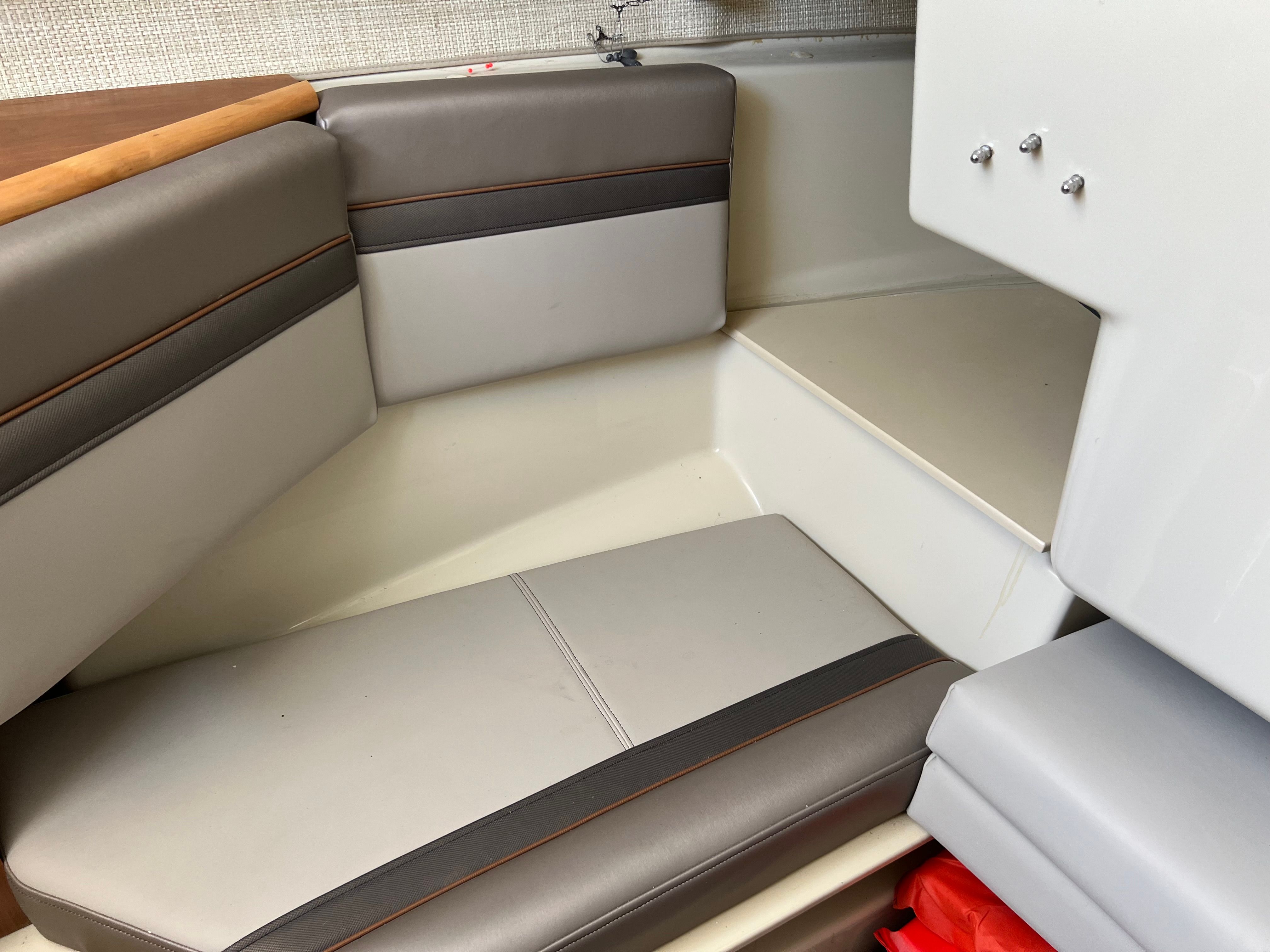 Interior of a 2022 Cutwater C-24 CW boat with cushioned seating.