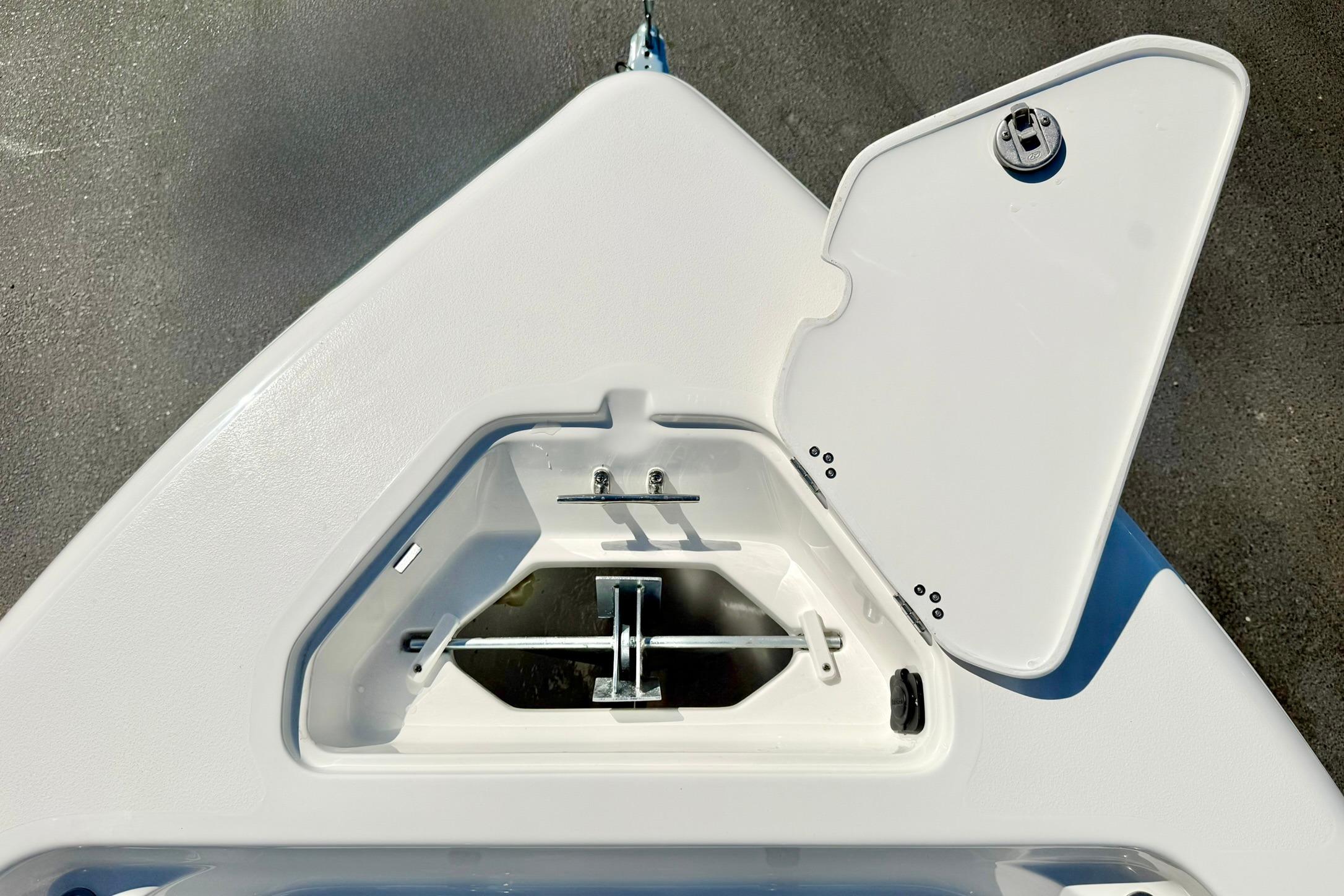 Open storage compartment on 2026 Key West 189 FS boat deck.