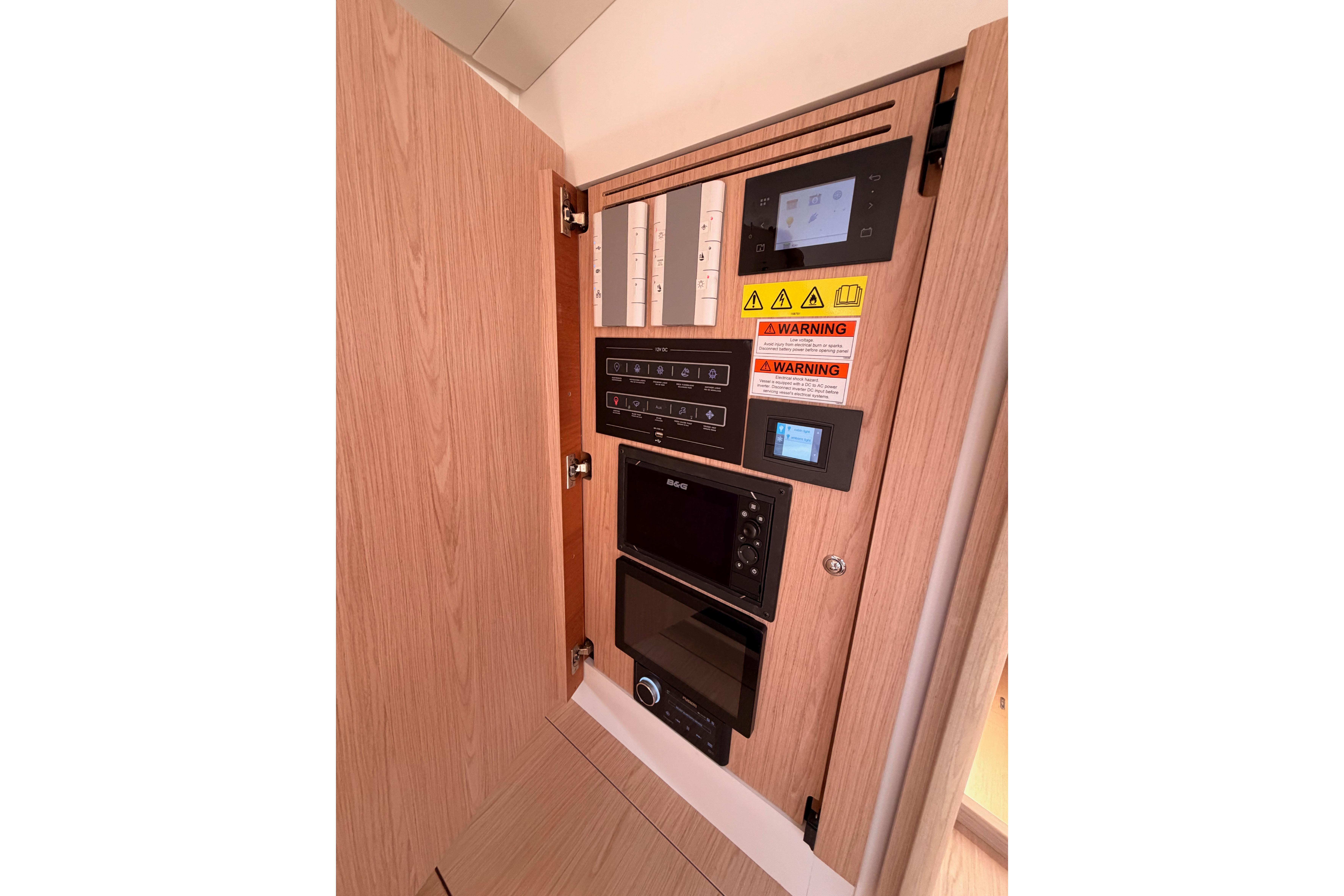 Control panel inside 2022 Beneteau Oceanis Yacht 54, featuring modern navigation and safety systems.