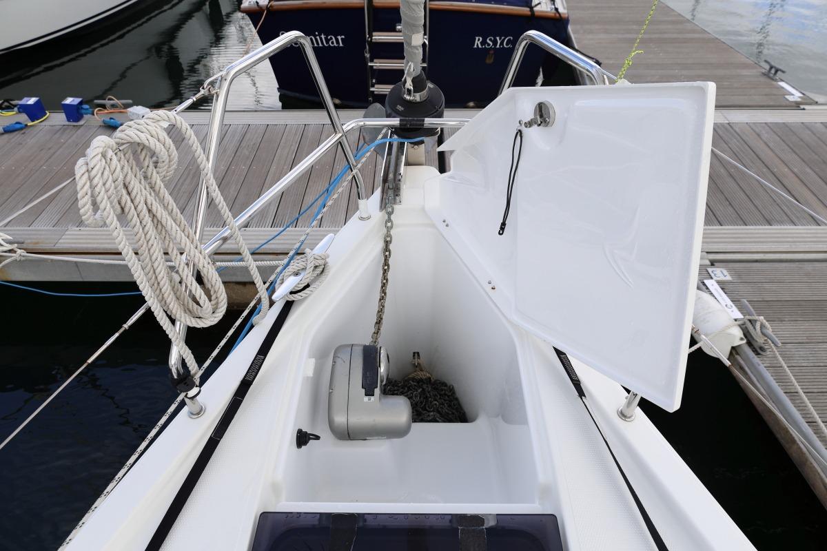 2021 Hanse 388 yacht anchor locker with open hatch and coiled rope on deck.