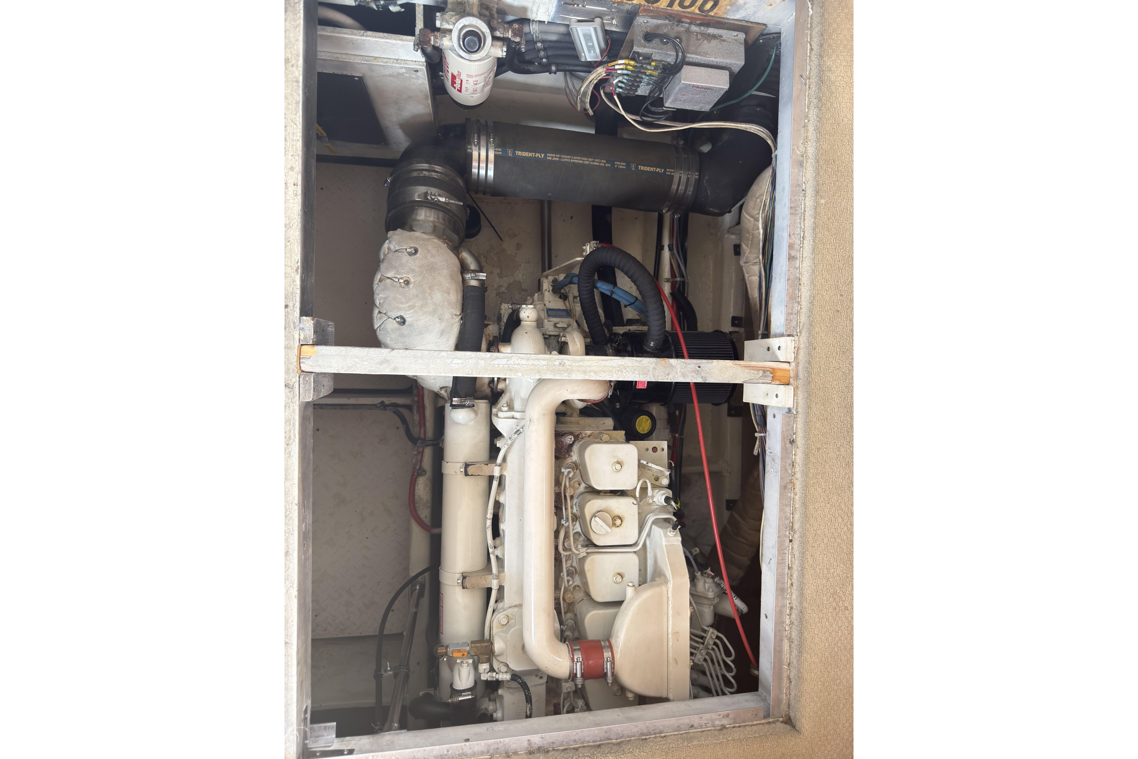 Engine compartment of 1997 Bayliner 3788 Command Bridge Motoryacht, showcasing mechanical components.