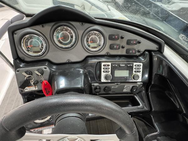 Dashboard of a 2014 Yamaha Boats 212X, featuring gauges and controls.