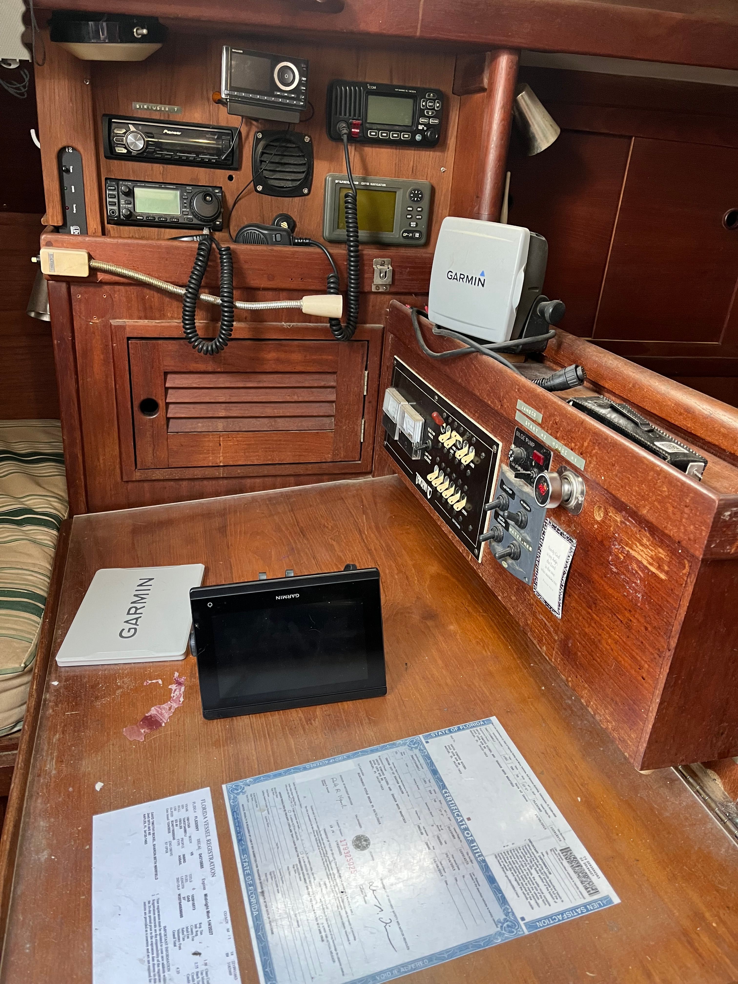 Interior view of a 1981 Tartan Sloop with navigation equipment and wooden furnishings.