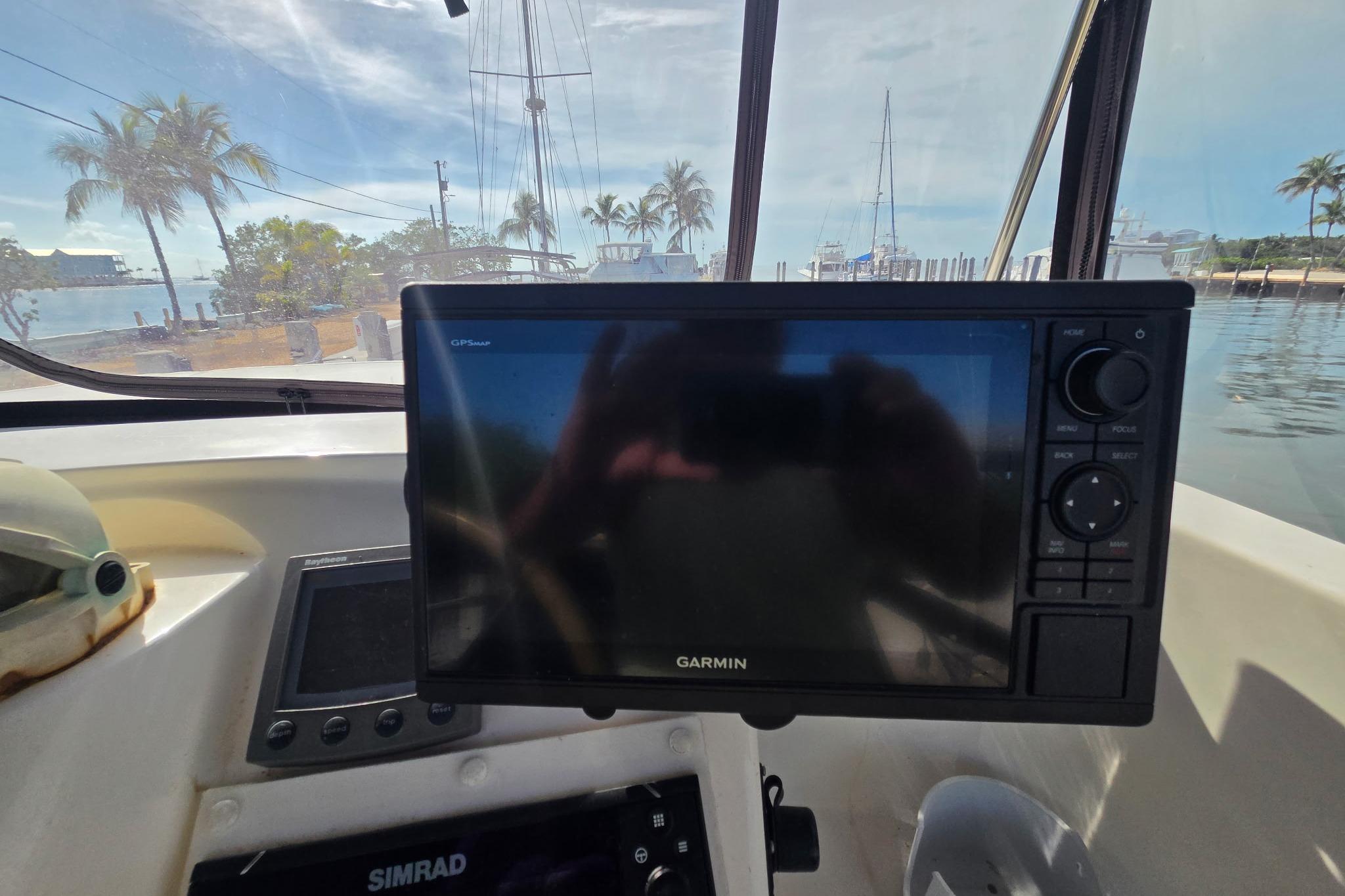Garmin GPS on Fountaine Pajot Maryland 37 yacht, docked with palm trees in background.