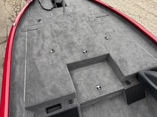 2025 Tracker Savage 215 boat deck with gray carpet and storage compartments.